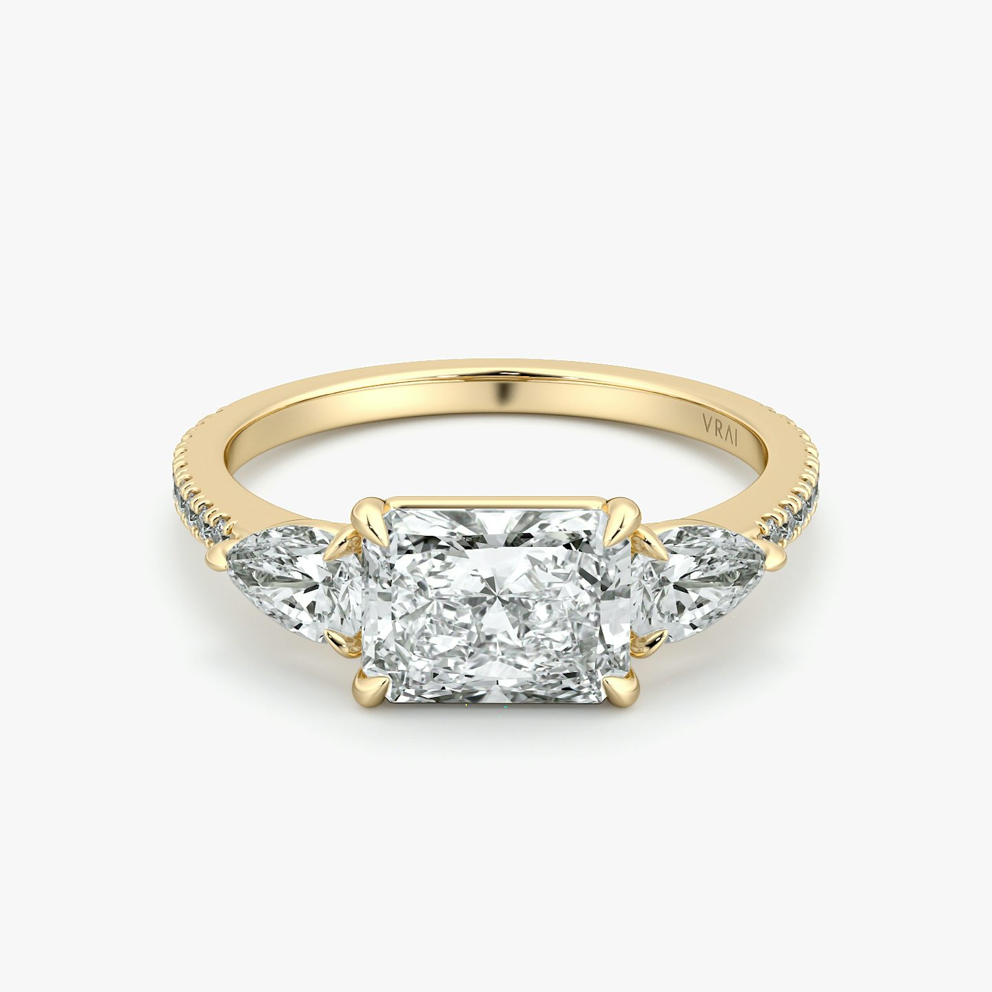 The Three Stone | Radiant | 18k | Yellow Gold | bandAccent: Pavé | diamondOrientation: horizontal | sideStoneCarat: 0.25ct | sideStoneShape: Pear | caratWeight: other