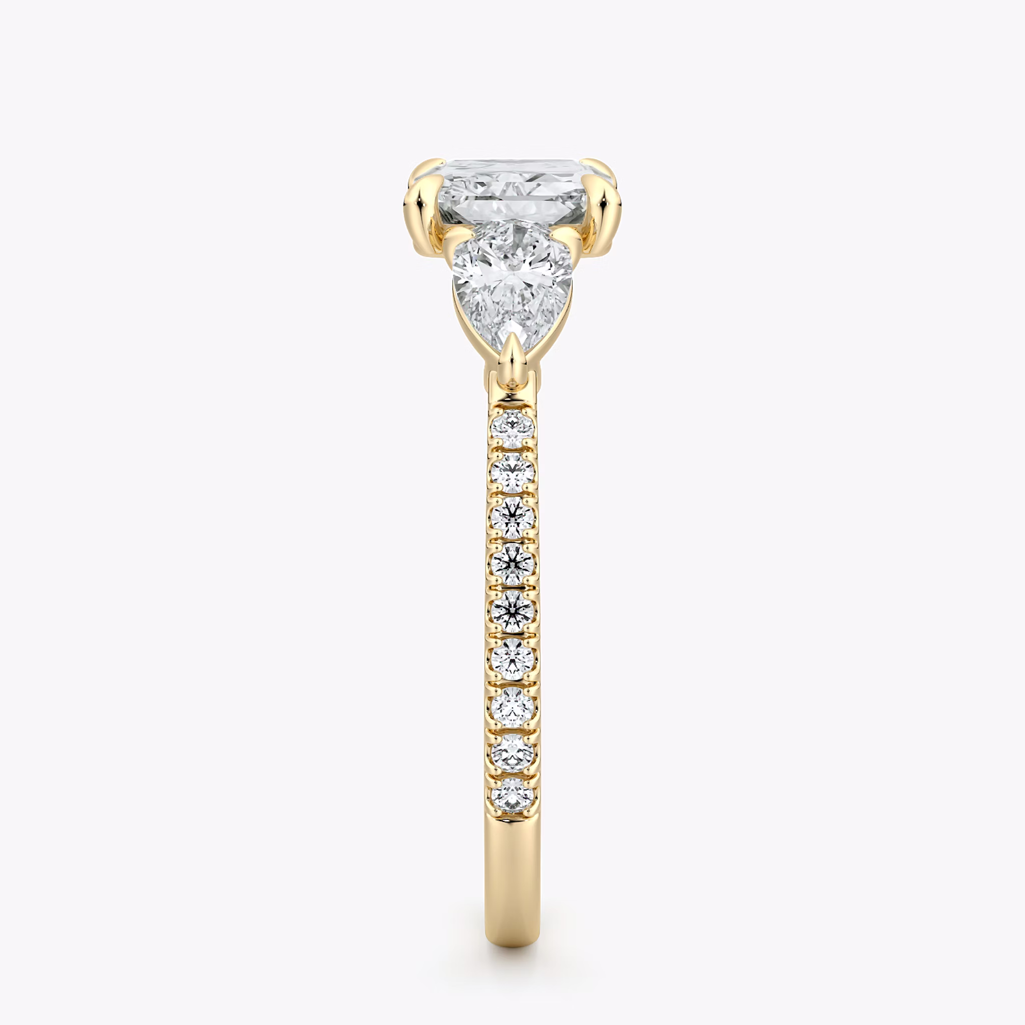 The Three Stone | Radiant | 18k | Yellow Gold | bandAccent: Pavé | diamondOrientation: horizontal | sideStoneCarat: 0.25ct | sideStoneShape: Pear | caratWeight: other