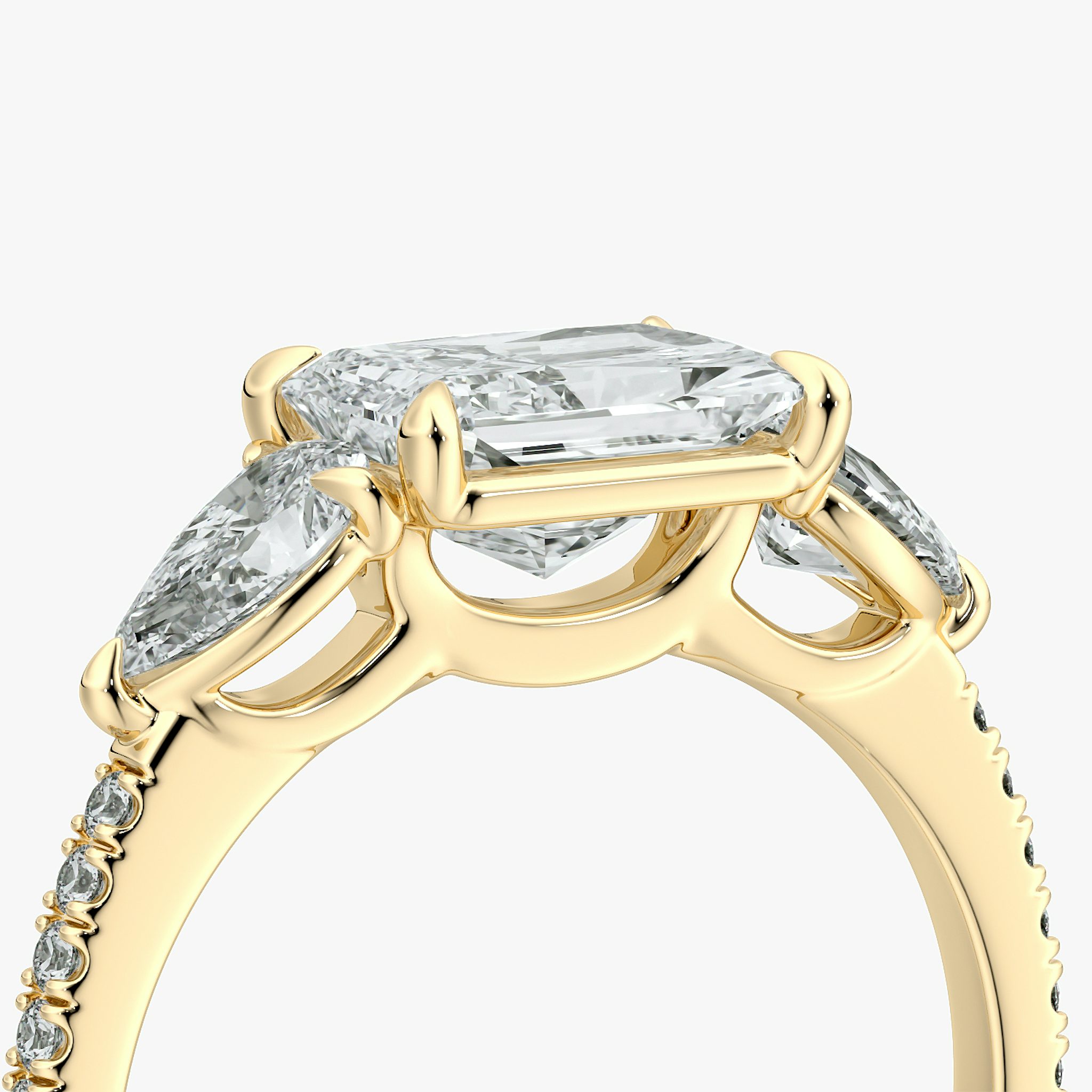 The Three Stone | Radiant | 18k | Yellow Gold | bandAccent: Pavé | diamondOrientation: horizontal | sideStoneCarat: 0.25ct | sideStoneShape: Pear | caratWeight: other