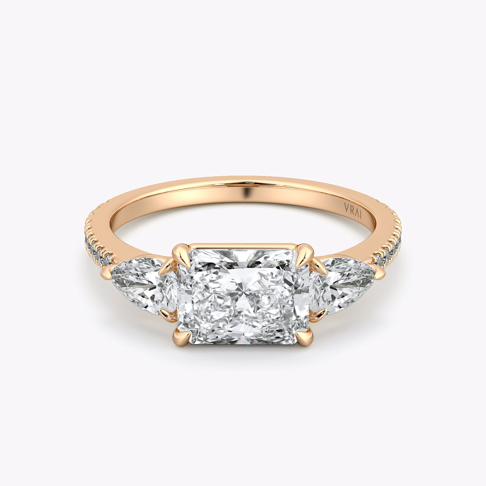 The Three Stone | Radiant | 14k | Rose Gold | bandAccent: Pavé | diamondOrientation: horizontal | sideStoneCarat: 0.25ct | sideStoneShape: Pear | caratWeight: other