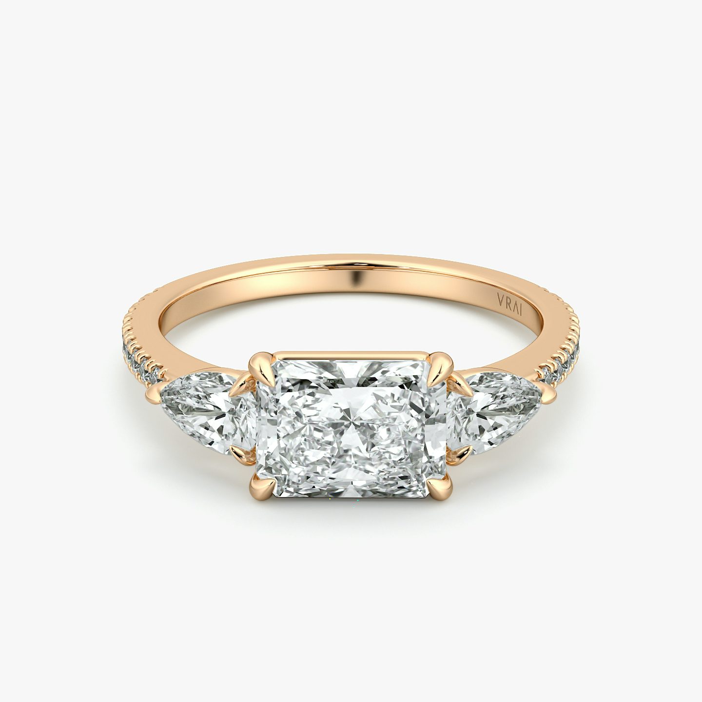 The Three Stone | Radiant | 14k | Rose Gold | bandAccent: Pavé | diamondOrientation: horizontal | sideStoneCarat: 0.25ct | sideStoneShape: Pear | caratWeight: other
