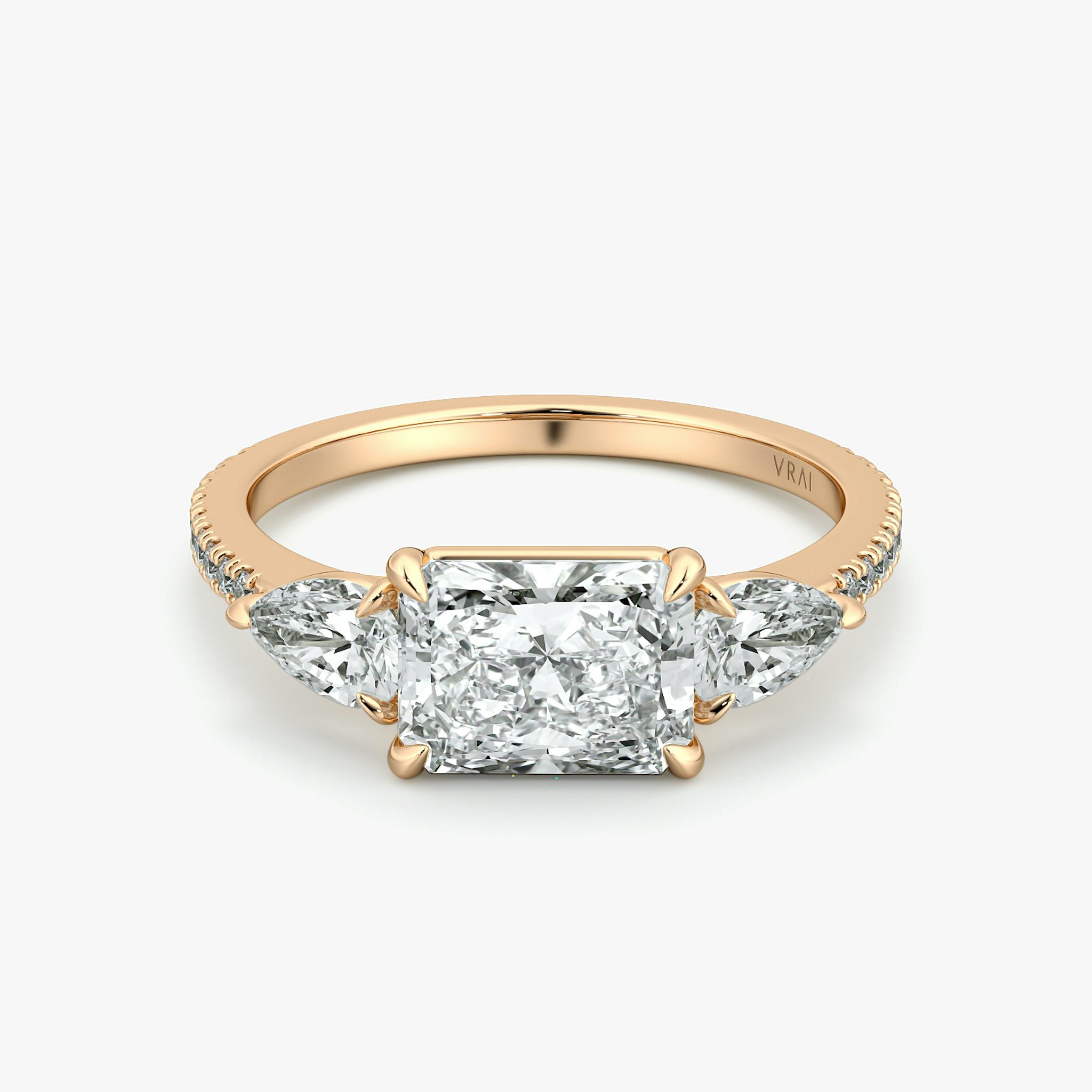 The Three Stone | Radiant | 14k | Rose Gold | bandAccent: Pavé | diamondOrientation: horizontal | sideStoneCarat: 0.25ct | sideStoneShape: Pear | caratWeight: other