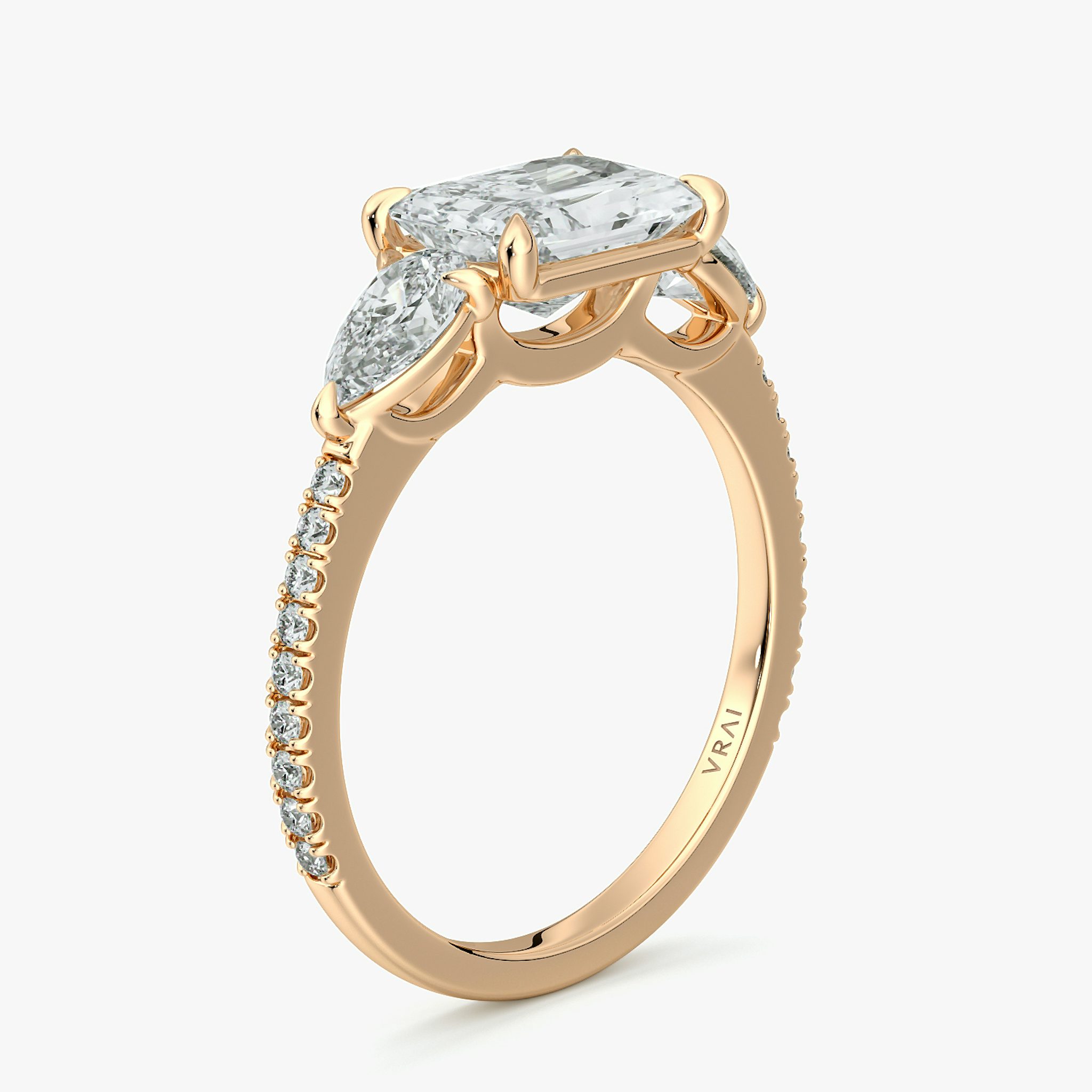 The Three Stone | Radiant | 14k | Rose Gold | bandAccent: Pavé | diamondOrientation: horizontal | sideStoneCarat: 0.25ct | sideStoneShape: Pear | caratWeight: other