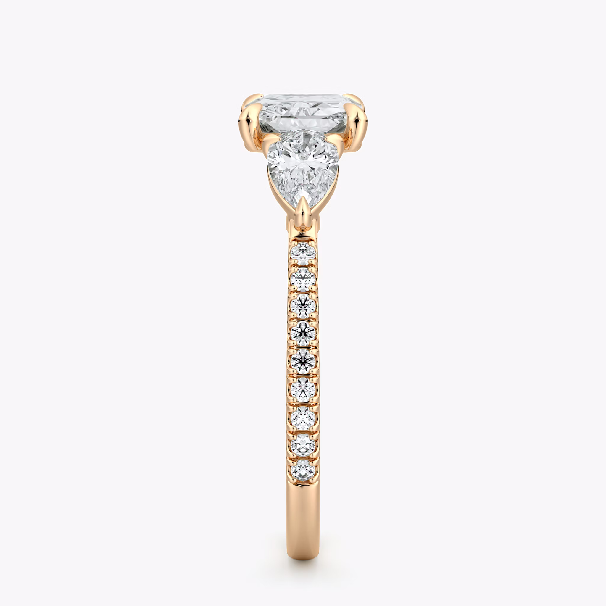 The Three Stone | Radiant | 14k | Rose Gold | bandAccent: Pavé | diamondOrientation: horizontal | sideStoneCarat: 0.25ct | sideStoneShape: Pear | caratWeight: other