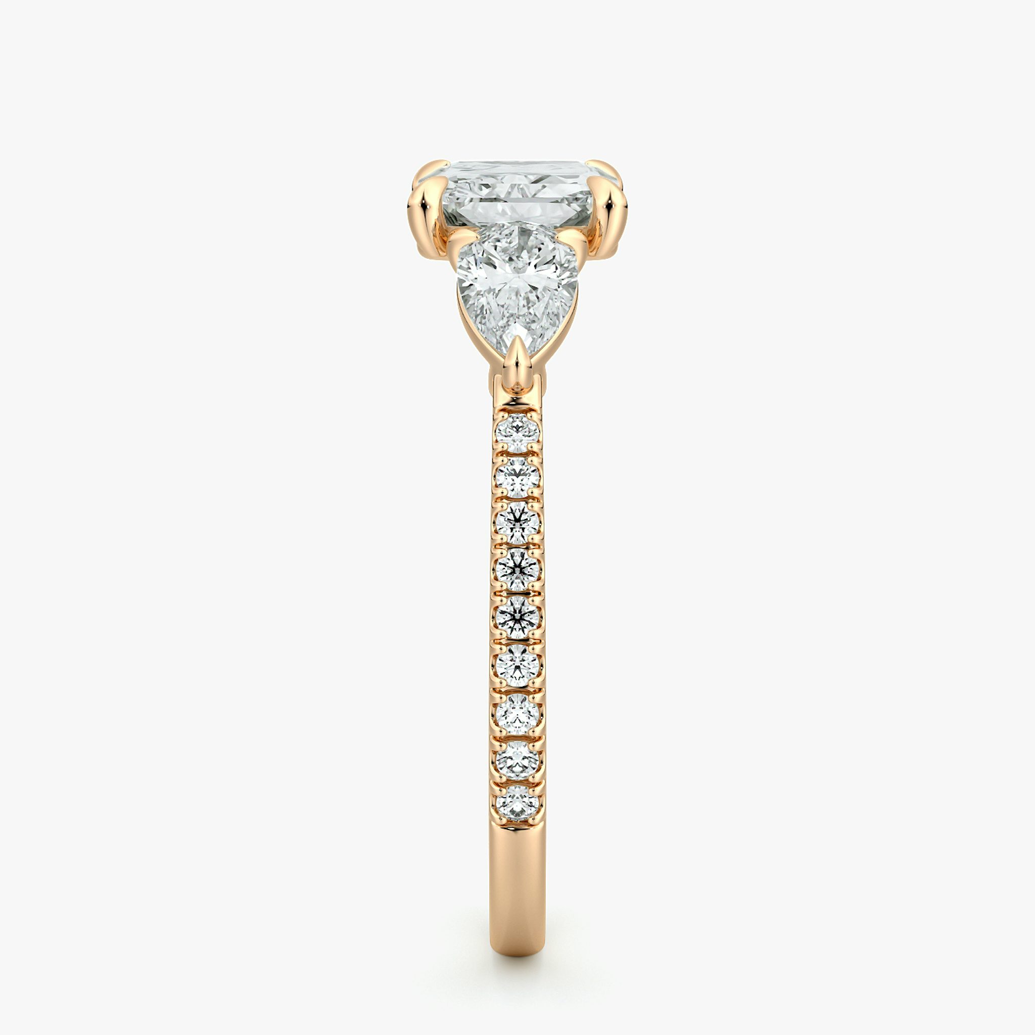 The Three Stone | Radiant | 14k | Rose Gold | bandAccent: Pavé | diamondOrientation: horizontal | sideStoneCarat: 0.25ct | sideStoneShape: Pear | caratWeight: other
