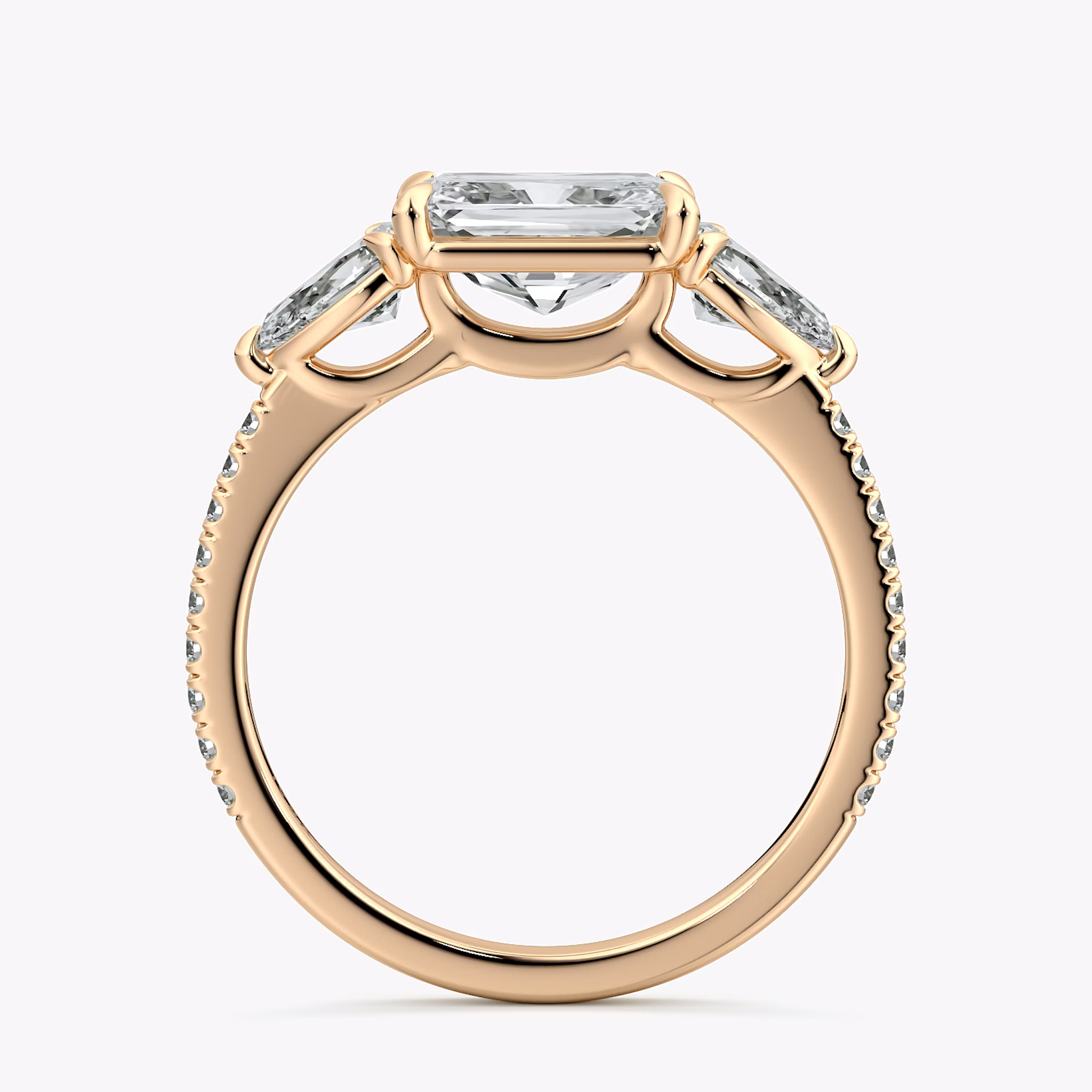 The Three Stone | Radiant | 14k | Rose Gold | bandAccent: Pavé | diamondOrientation: horizontal | sideStoneCarat: 0.25ct | sideStoneShape: Pear | caratWeight: other
