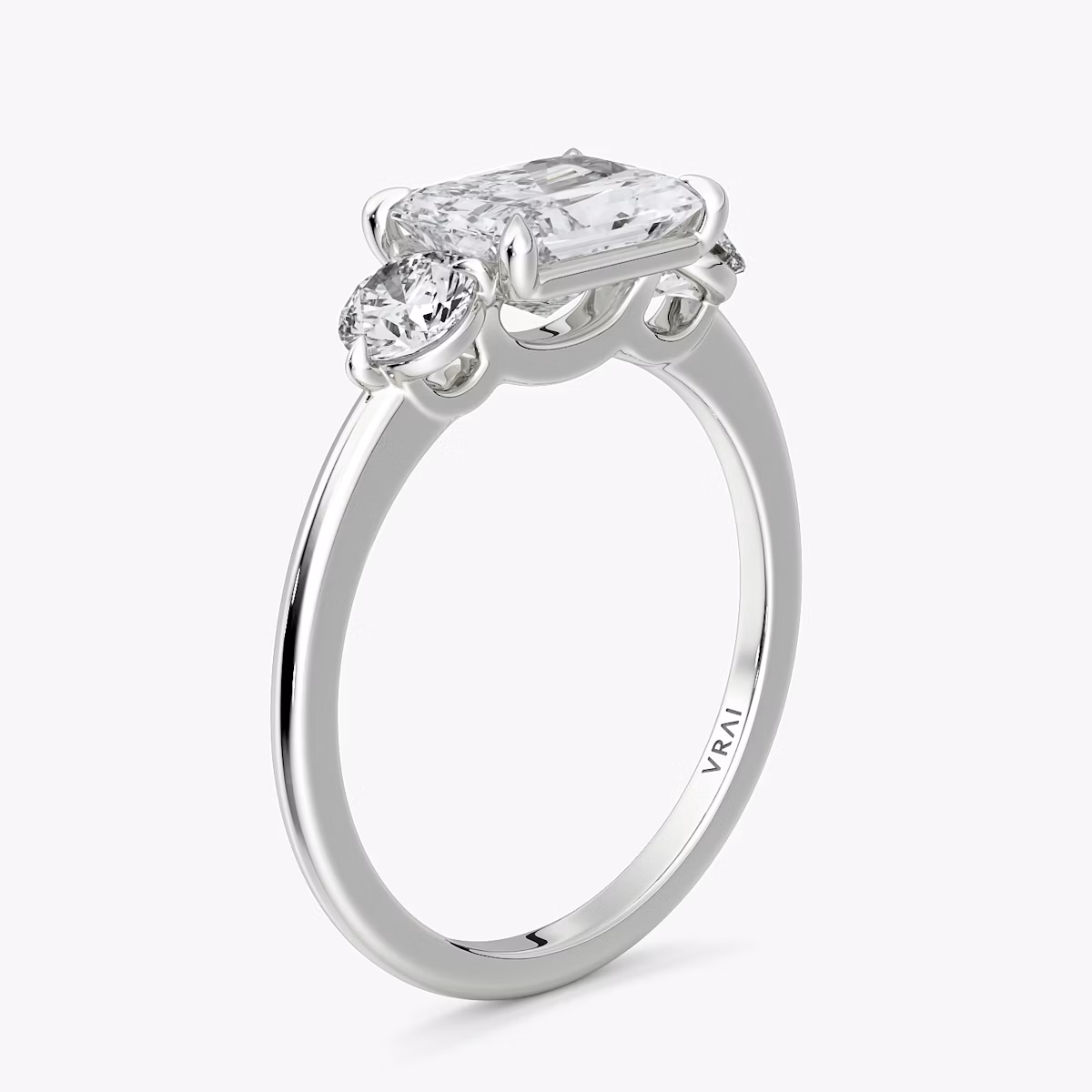 The Three Stone | Radiant | 18k | White Gold | bandAccent: Plain | diamondOrientation: horizontal | sideStoneCarat: 0.25ct | sideStoneShape: Round Brilliant | caratWeight: other