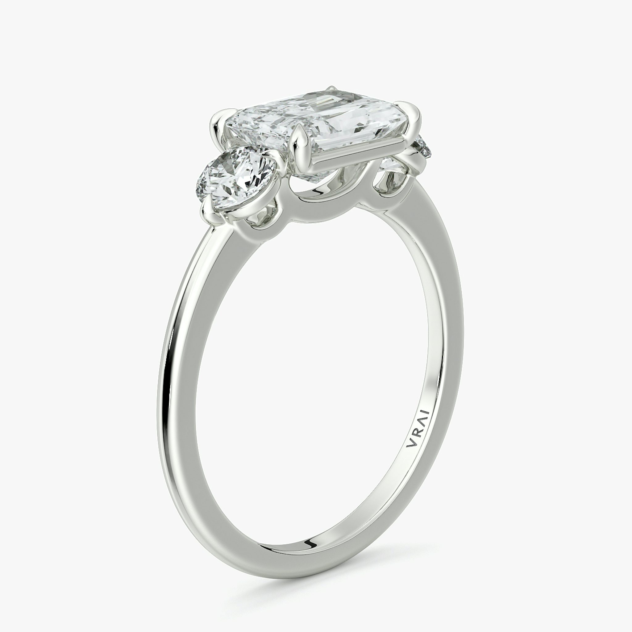 The Three Stone | Radiant | Platinum | bandAccent: Plain | diamondOrientation: horizontal | sideStoneCarat: 0.25ct | sideStoneShape: Round Brilliant | caratWeight: other