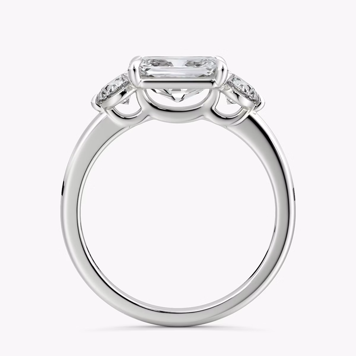 The Three Stone | Radiant | 18k | White Gold | bandAccent: Plain | diamondOrientation: horizontal | sideStoneCarat: 0.25ct | sideStoneShape: Round Brilliant | caratWeight: other
