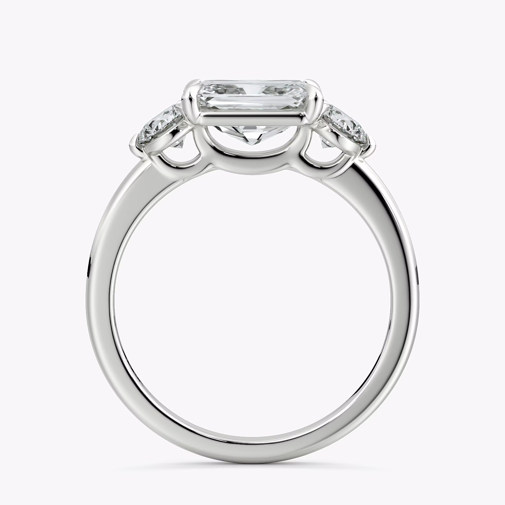 The Three Stone | Radiant | Platinum | bandAccent: Plain | diamondOrientation: horizontal | sideStoneCarat: 0.25ct | sideStoneShape: Round Brilliant | caratWeight: other