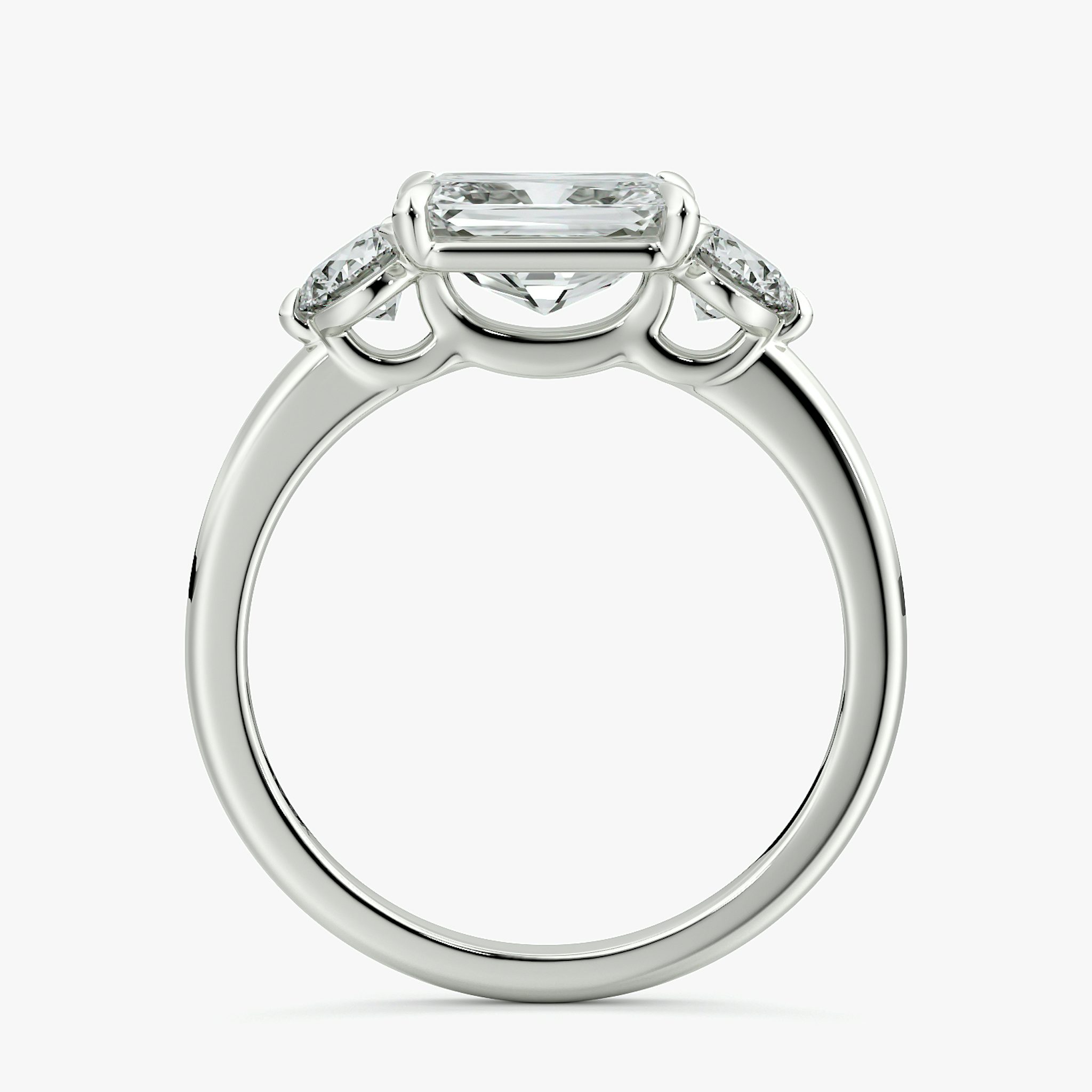 The Three Stone | Radiant | Platinum | bandAccent: Plain | diamondOrientation: horizontal | sideStoneCarat: 0.25ct | sideStoneShape: Round Brilliant | caratWeight: other