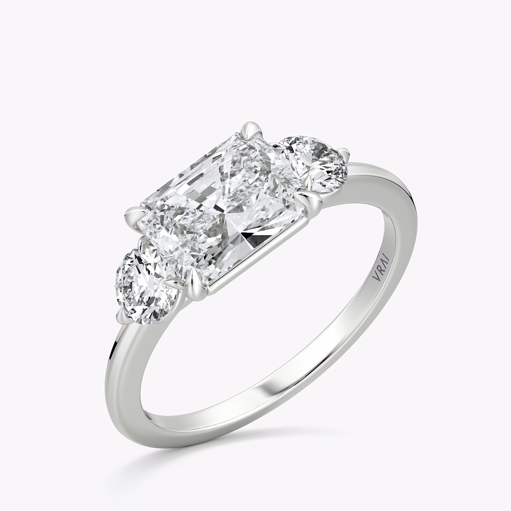 The Three Stone | Radiant | Platinum | bandAccent: Plain | diamondOrientation: horizontal | sideStoneCarat: 0.25ct | sideStoneShape: Round Brilliant | caratWeight: other