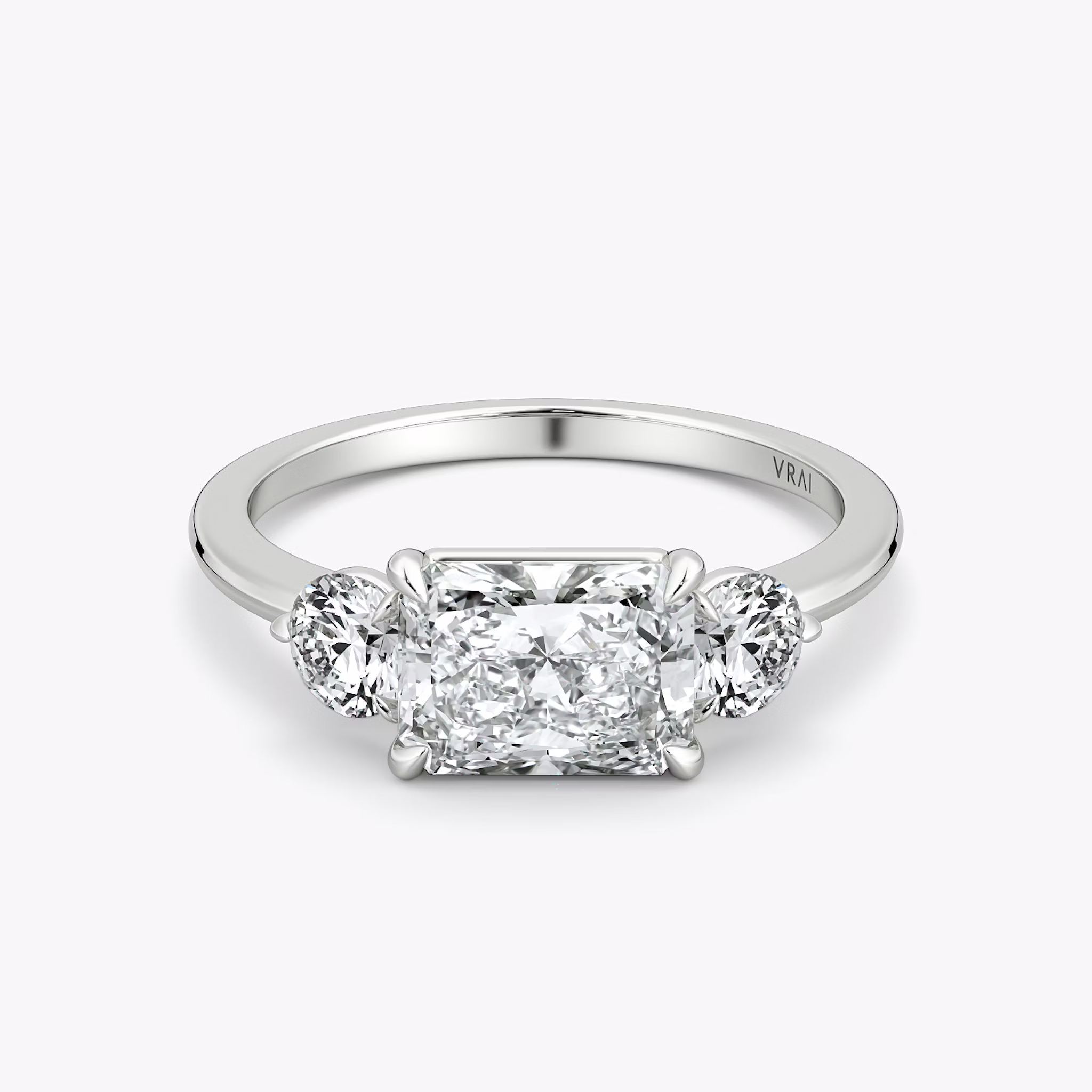 The Three Stone | Radiant | Platinum | bandAccent: Plain | diamondOrientation: horizontal | sideStoneCarat: 0.25ct | sideStoneShape: Round Brilliant | caratWeight: other