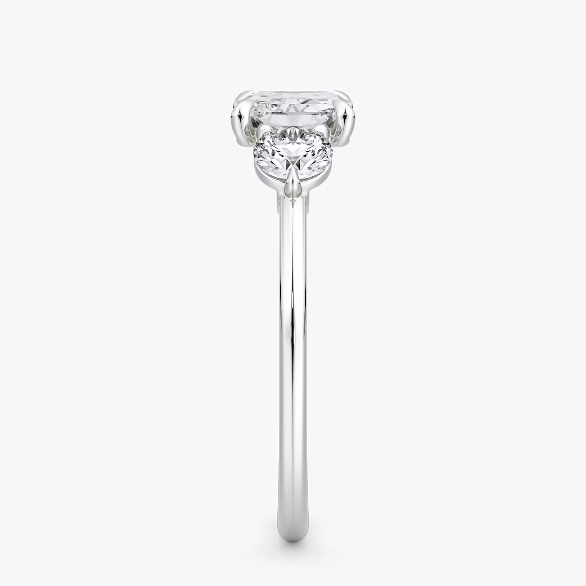 The Three Stone | Radiant | 18k | White Gold | bandAccent: Plain | diamondOrientation: horizontal | sideStoneCarat: 0.25ct | sideStoneShape: Round Brilliant | caratWeight: other