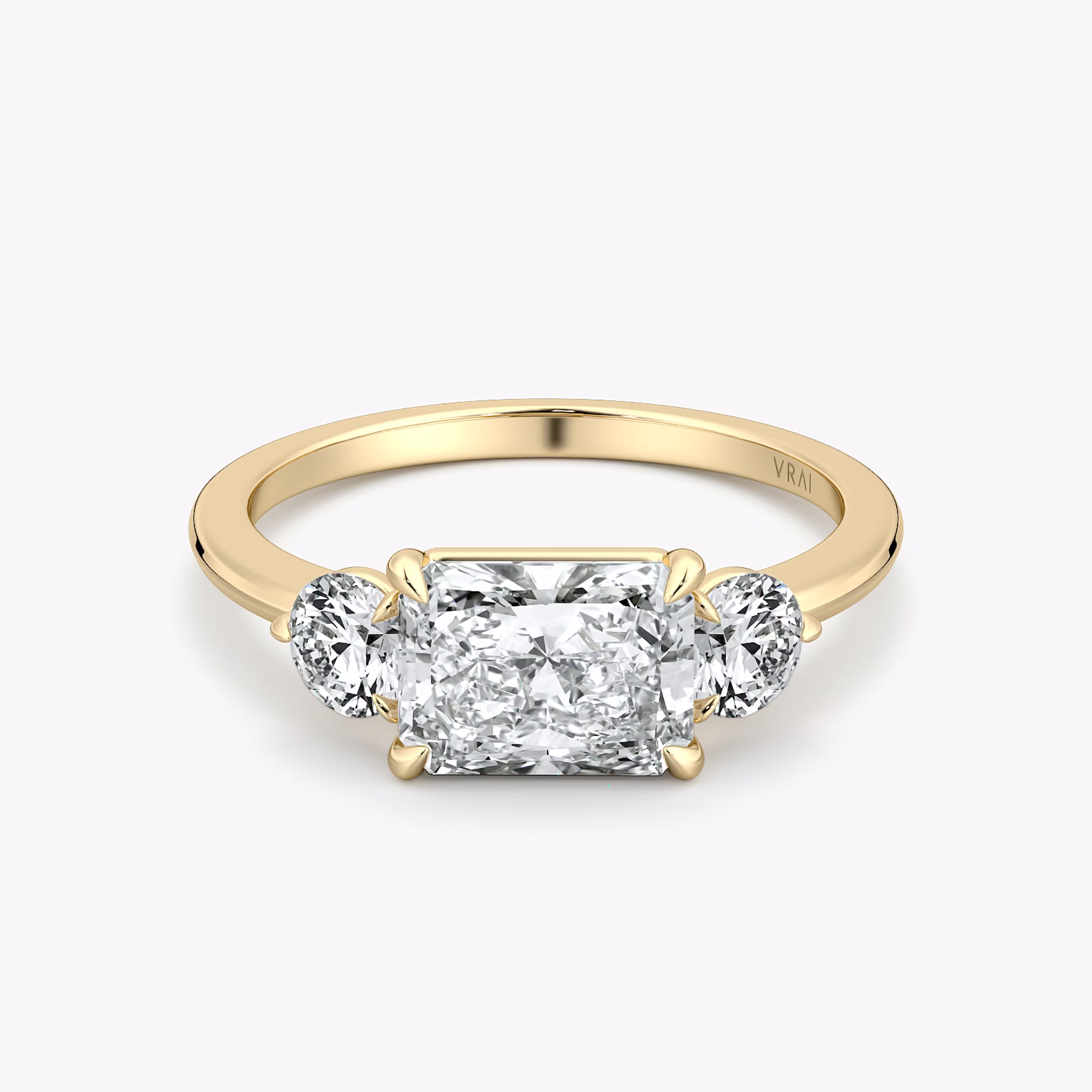 The Three Stone | Radiant | 18k | Yellow Gold | bandAccent: Plain | diamondOrientation: horizontal | sideStoneCarat: 0.25ct | sideStoneShape: Round Brilliant | caratWeight: other