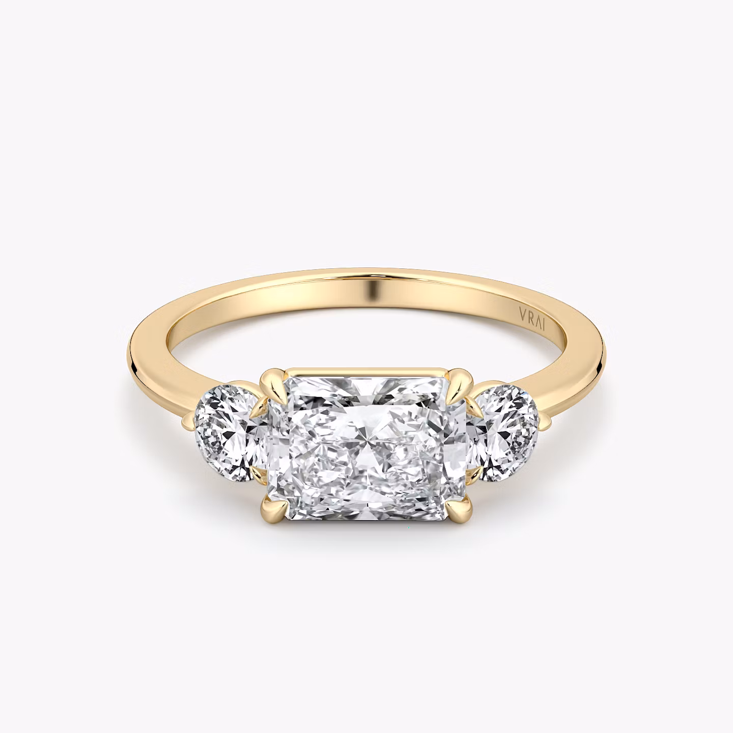 The Three Stone | Radiant | 18k | Yellow Gold | bandAccent: Plain | diamondOrientation: horizontal | sideStoneCarat: 0.25ct | sideStoneShape: Round Brilliant | caratWeight: other