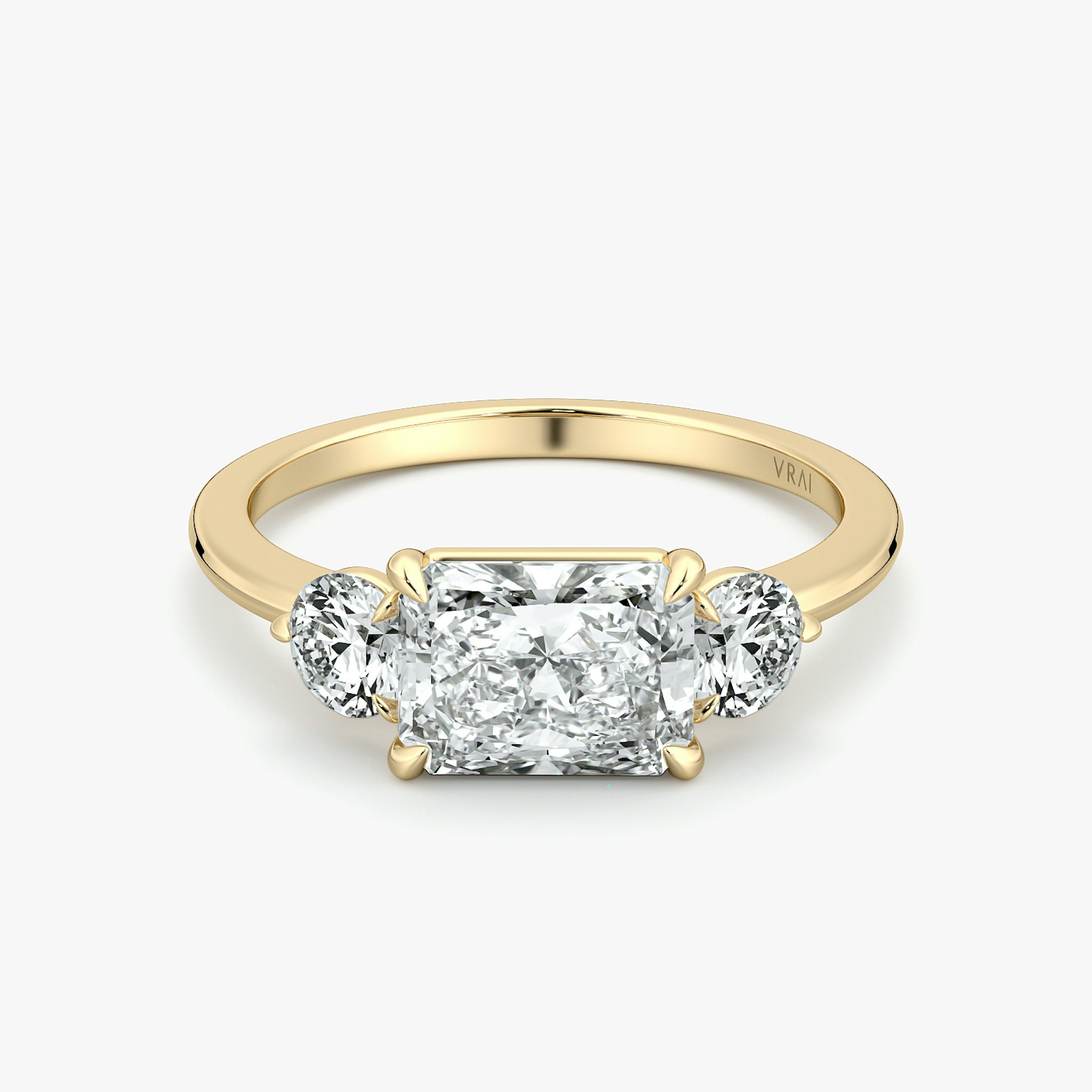 The Three Stone | Radiant | 18k | Yellow Gold | bandAccent: Plain | diamondOrientation: horizontal | sideStoneCarat: 0.25ct | sideStoneShape: Round Brilliant | caratWeight: other