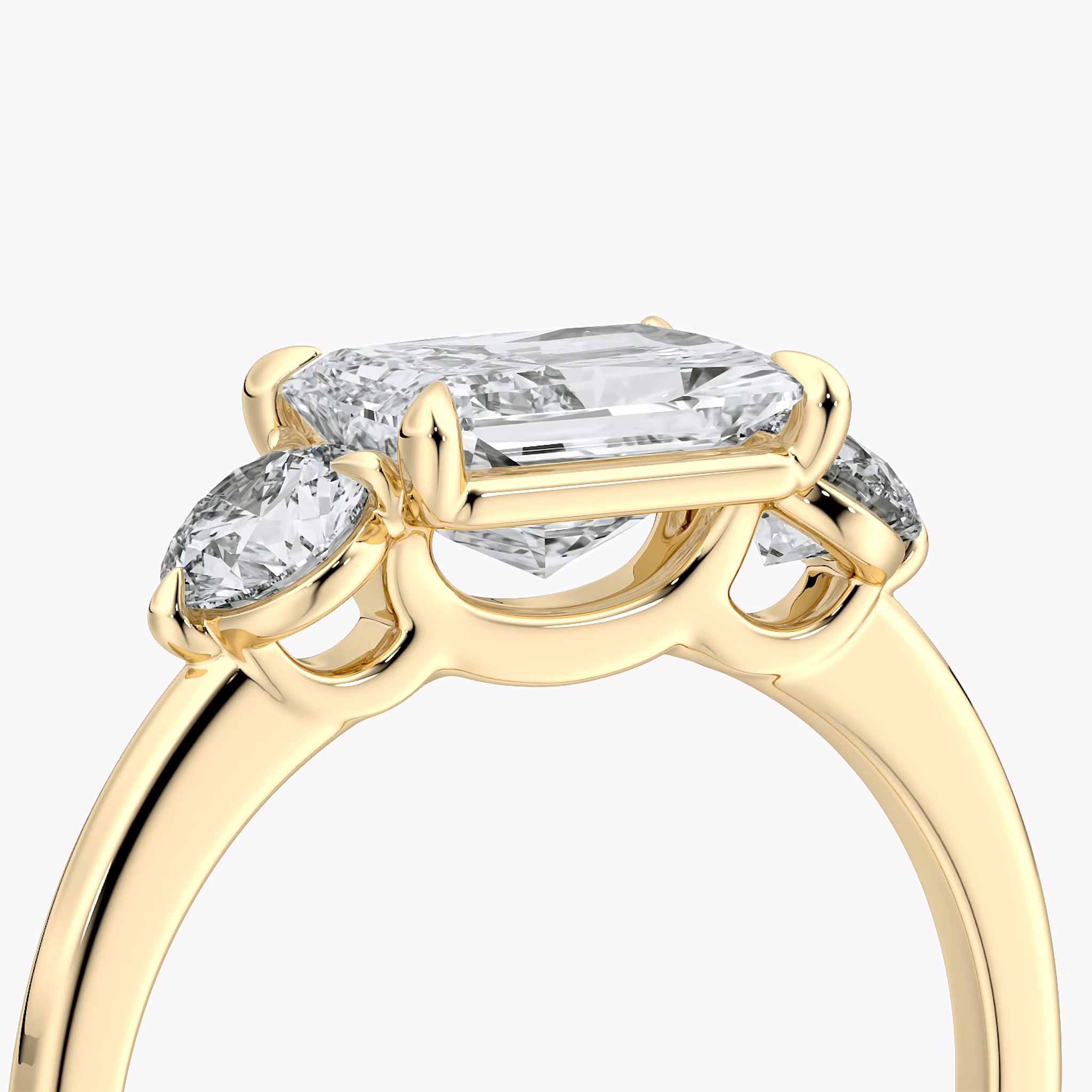 The Three Stone | Radiant | 18k | Yellow Gold | bandAccent: Plain | diamondOrientation: horizontal | sideStoneCarat: 0.25ct | sideStoneShape: Round Brilliant | caratWeight: other