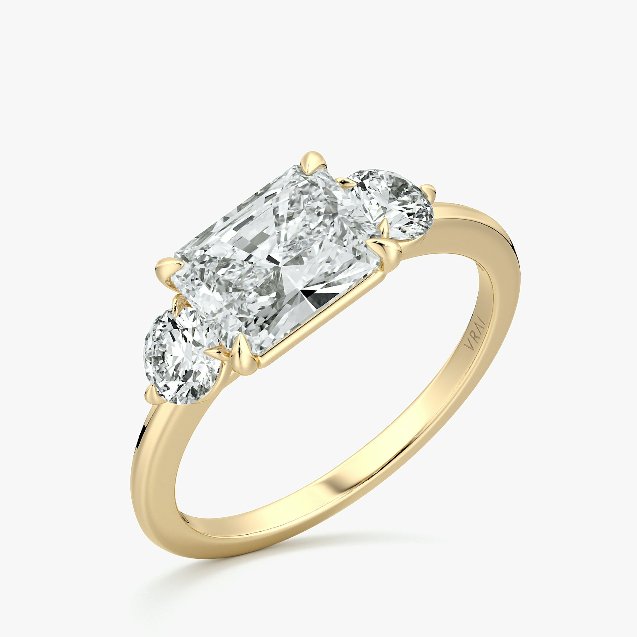 The Three Stone | Radiant | 18k | Yellow Gold | bandAccent: Plain | diamondOrientation: horizontal | sideStoneCarat: 0.25ct | sideStoneShape: Round Brilliant | caratWeight: other