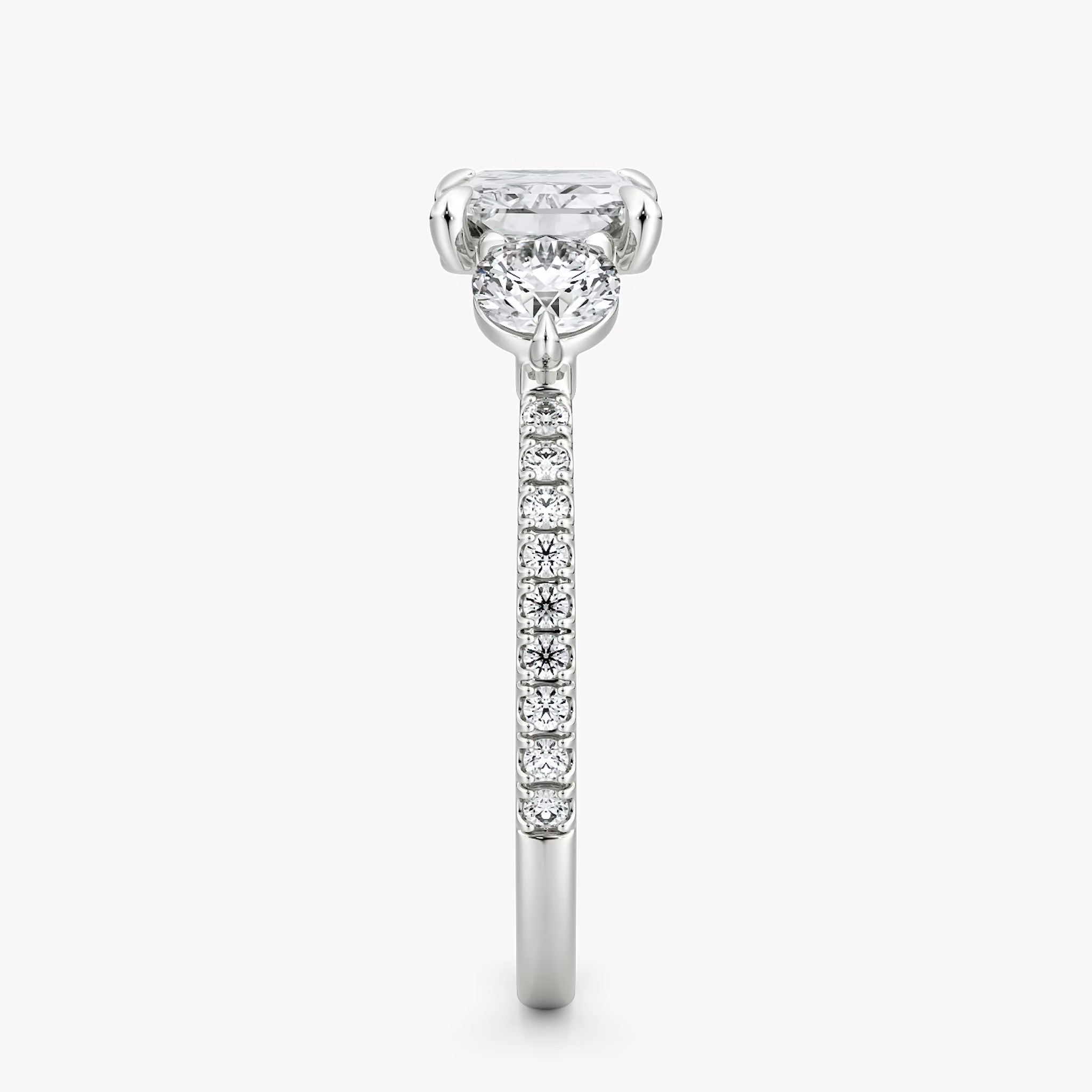 The Three Stone | Radiant | 18k | White Gold | bandAccent: Pavé | diamondOrientation: horizontal | sideStoneCarat: 0.25ct | sideStoneShape: Round Brilliant | caratWeight: other