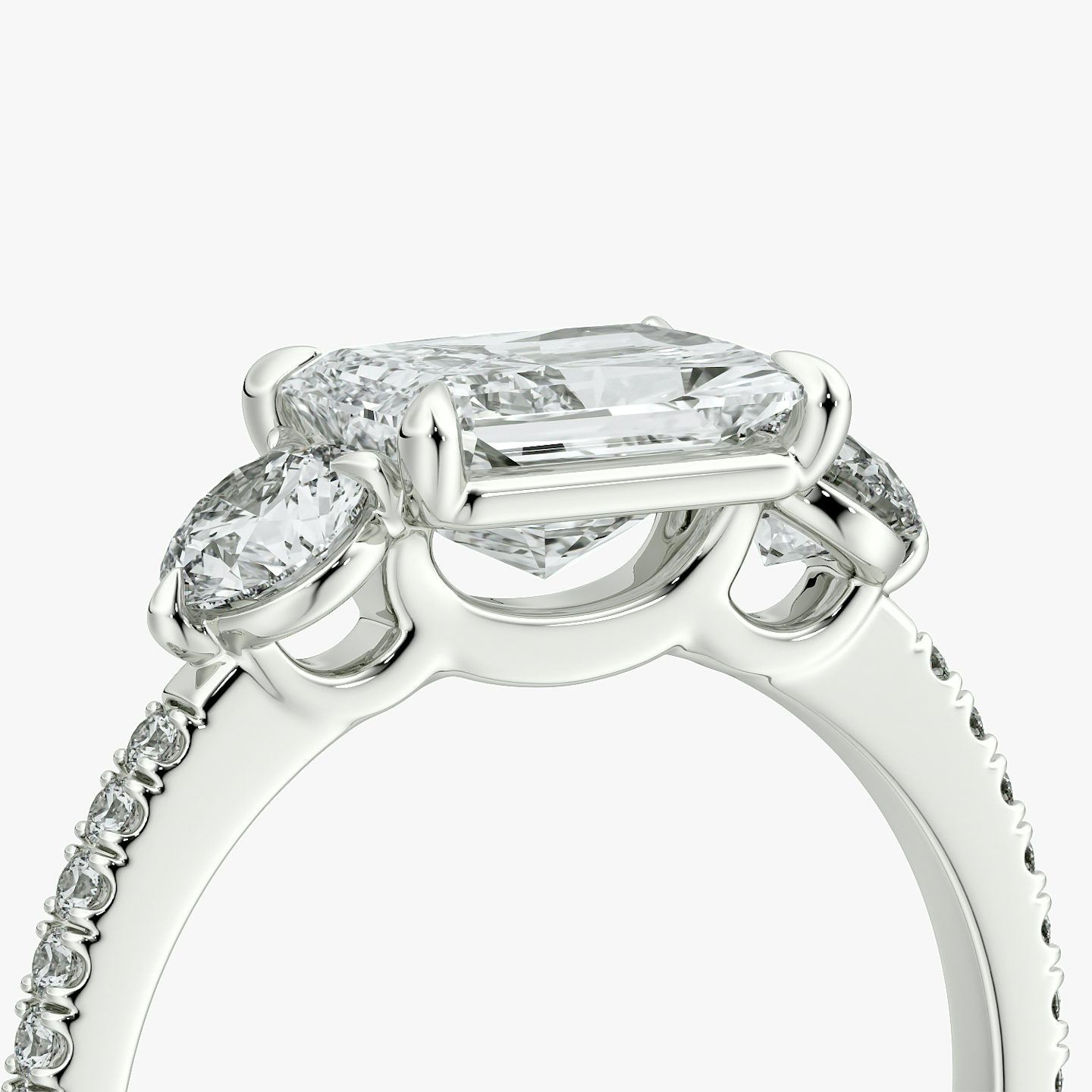 The Three Stone | Radiant | Platinum | bandAccent: Pavé | diamondOrientation: horizontal | sideStoneCarat: 0.25ct | sideStoneShape: Round Brilliant | caratWeight: other