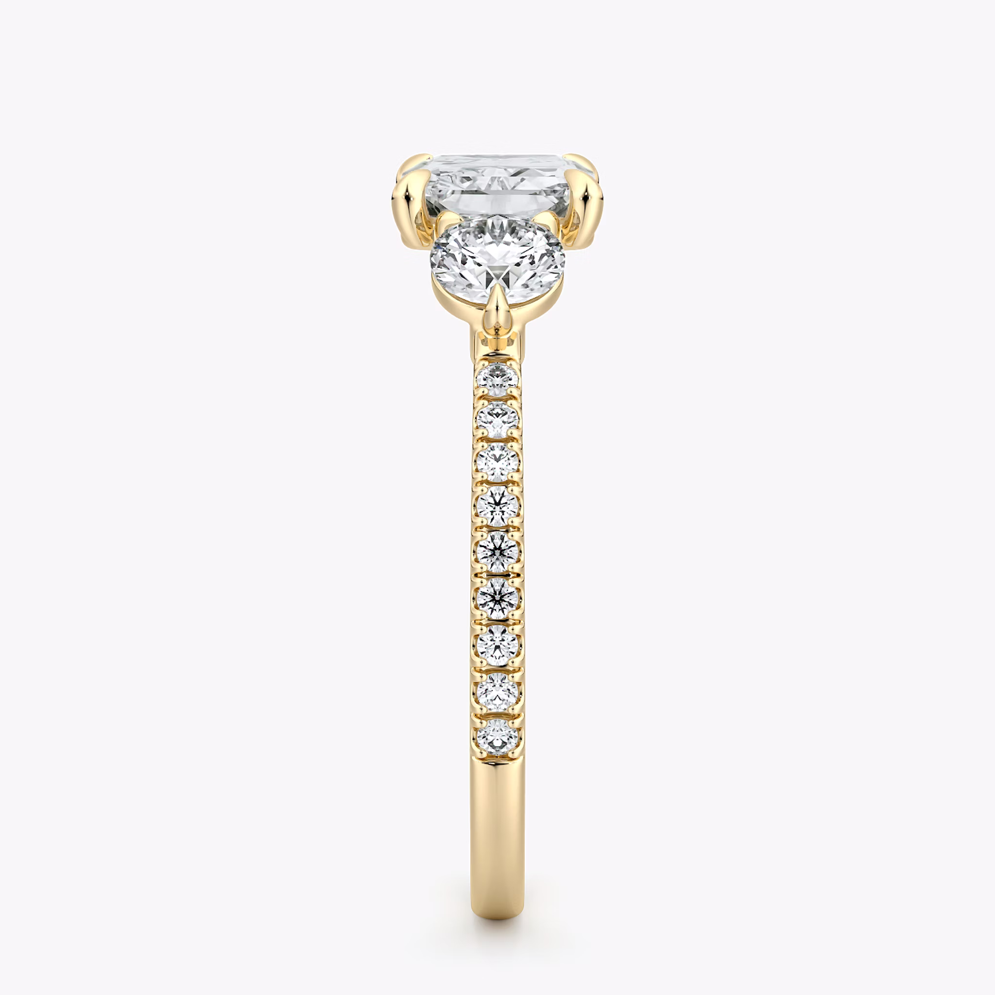 The Three Stone | Radiant | 18k | Yellow Gold | bandAccent: Pavé | diamondOrientation: horizontal | sideStoneCarat: 0.25ct | sideStoneShape: Round Brilliant | caratWeight: other