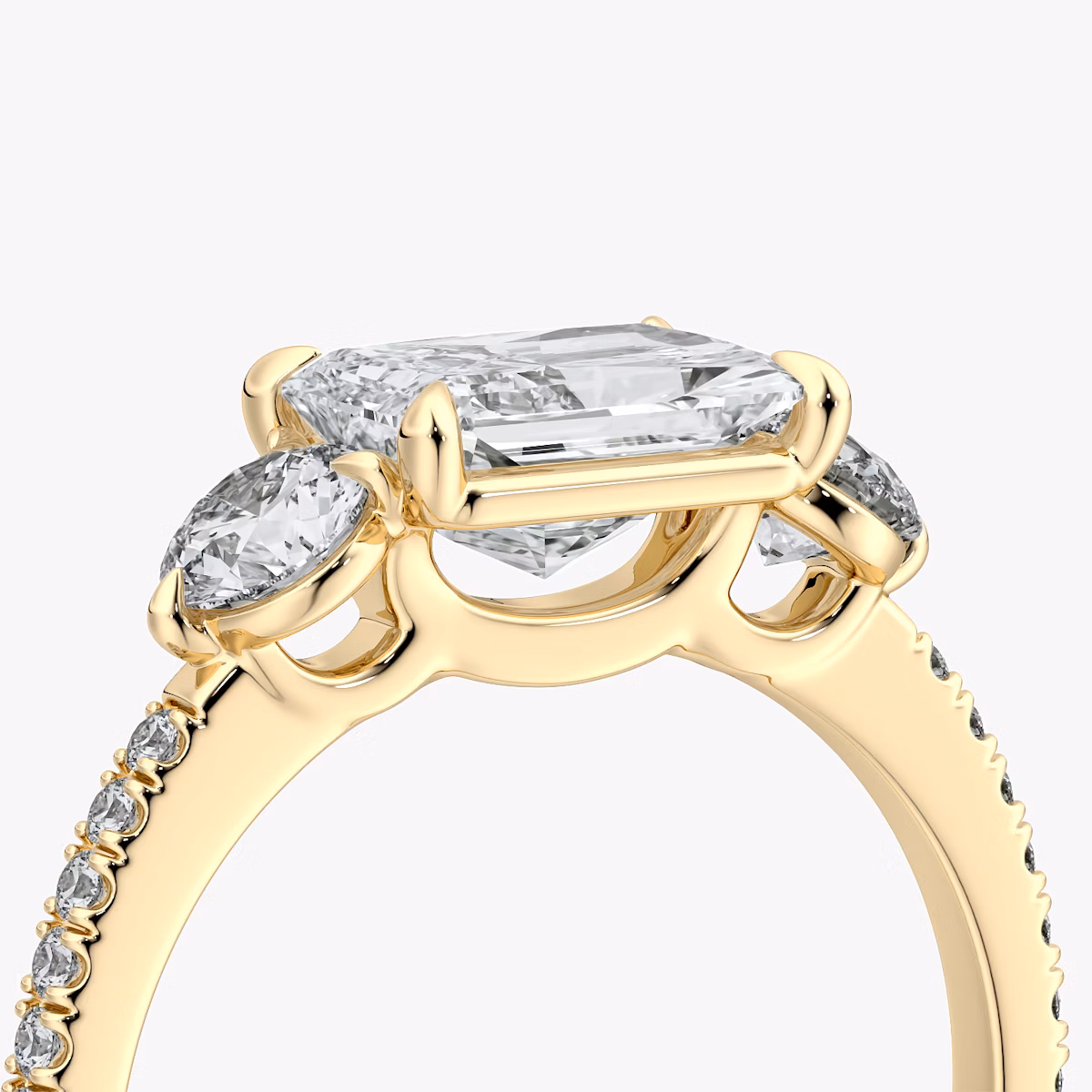 The Three Stone | Radiant | 18k | Yellow Gold | bandAccent: Pavé | diamondOrientation: horizontal | sideStoneCarat: 0.25ct | sideStoneShape: Round Brilliant | caratWeight: other