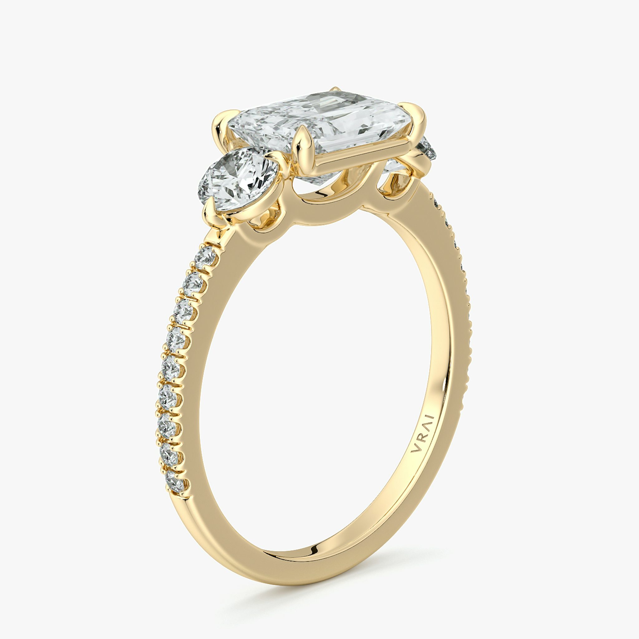 The Three Stone | Radiant | 18k | Yellow Gold | bandAccent: Pavé | diamondOrientation: horizontal | sideStoneCarat: 0.25ct | sideStoneShape: Round Brilliant | caratWeight: other
