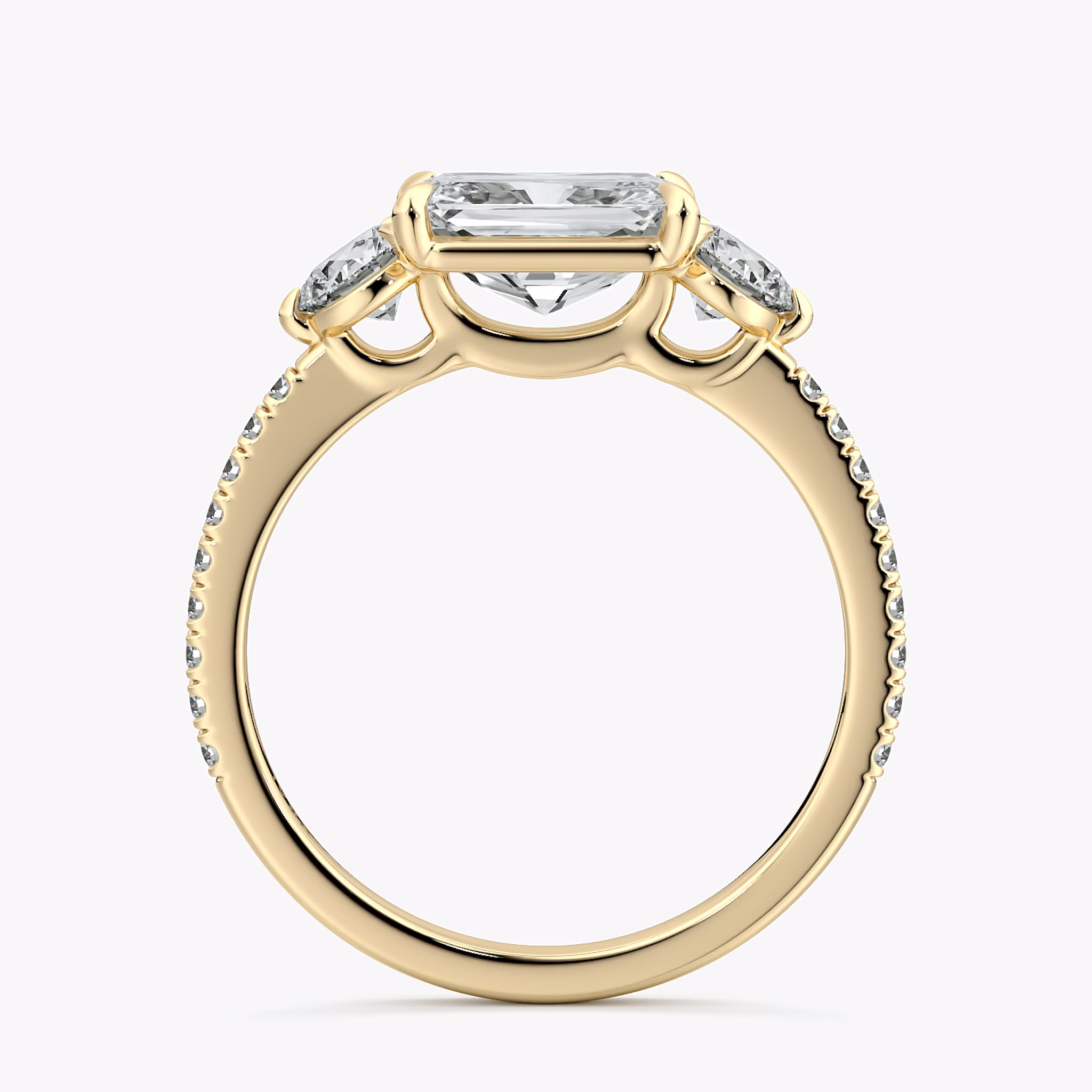The Three Stone | Radiant | 18k | Yellow Gold | bandAccent: Pavé | diamondOrientation: horizontal | sideStoneCarat: 0.25ct | sideStoneShape: Round Brilliant | caratWeight: other