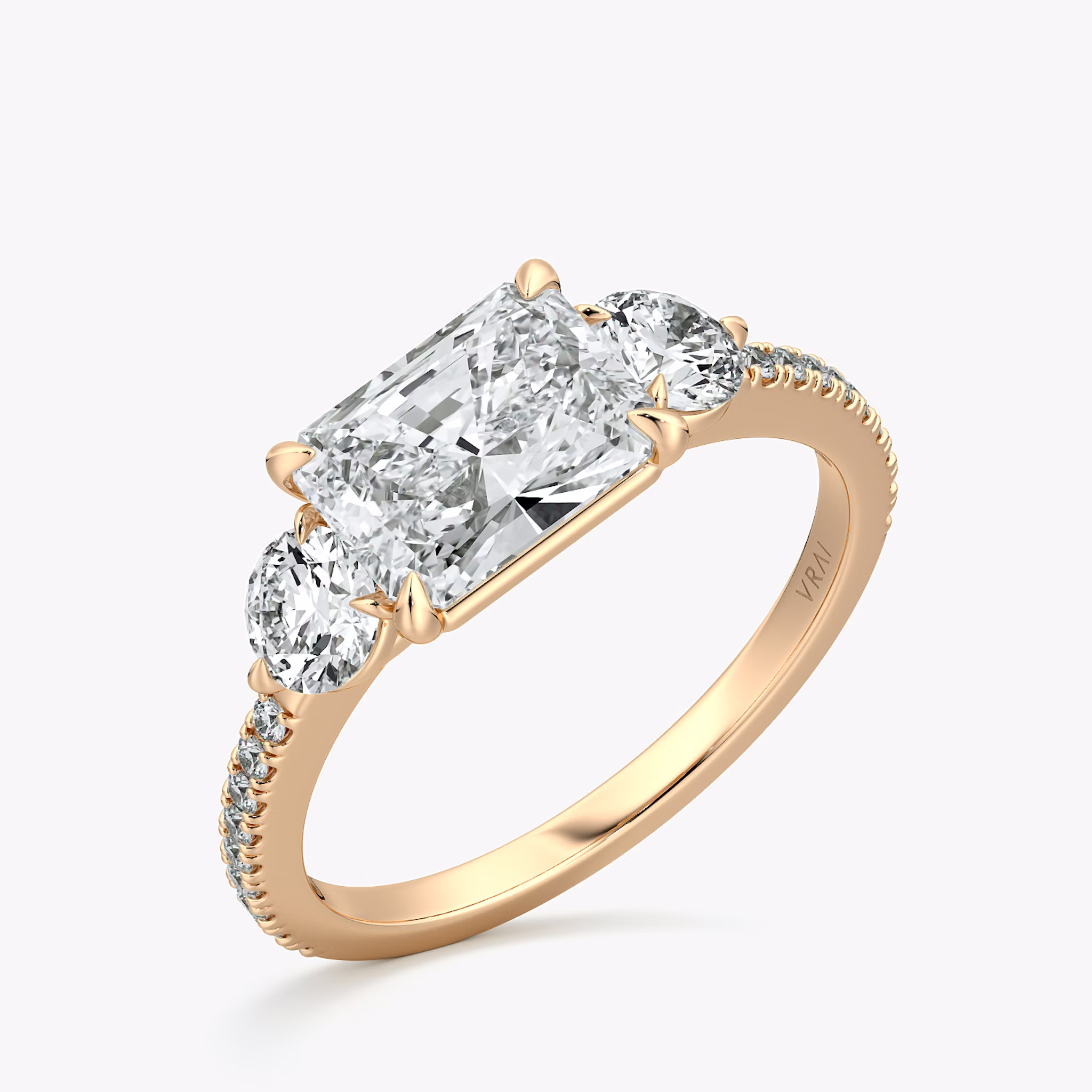 The Three Stone | Radiant | 14k | Rose Gold | bandAccent: Pavé | diamondOrientation: horizontal | sideStoneCarat: 0.25ct | sideStoneShape: Round Brilliant | caratWeight: other