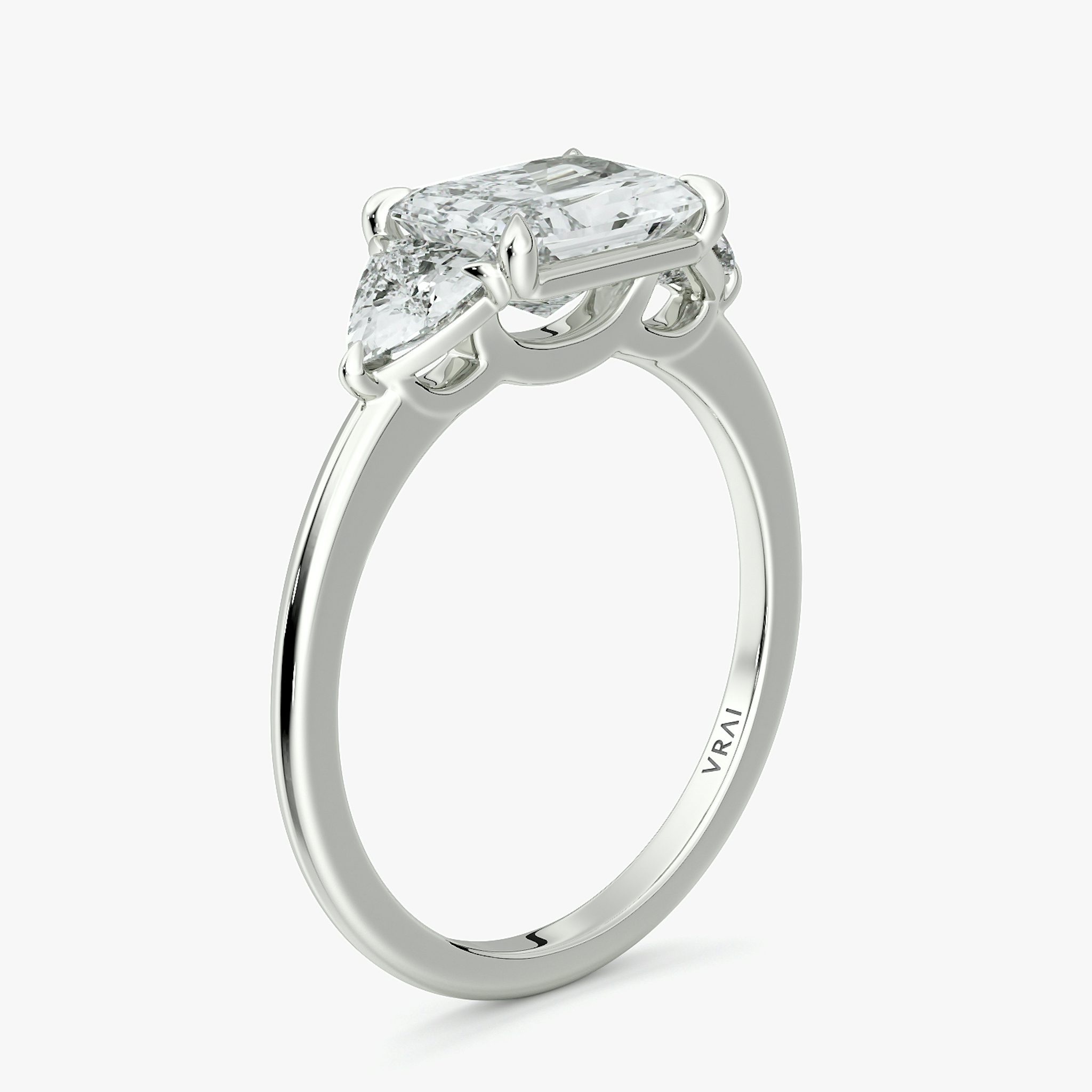 The Three Stone | Radiant | Platinum | bandAccent: Plain | diamondOrientation: horizontal | sideStoneCarat: 0.25ct | sideStoneShape: Trillion | caratWeight: other