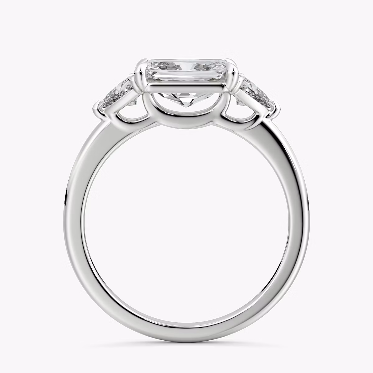 The Three Stone | Radiant | 18k | White Gold | bandAccent: Plain | diamondOrientation: horizontal | sideStoneCarat: 0.25ct | sideStoneShape: Trillion | caratWeight: other
