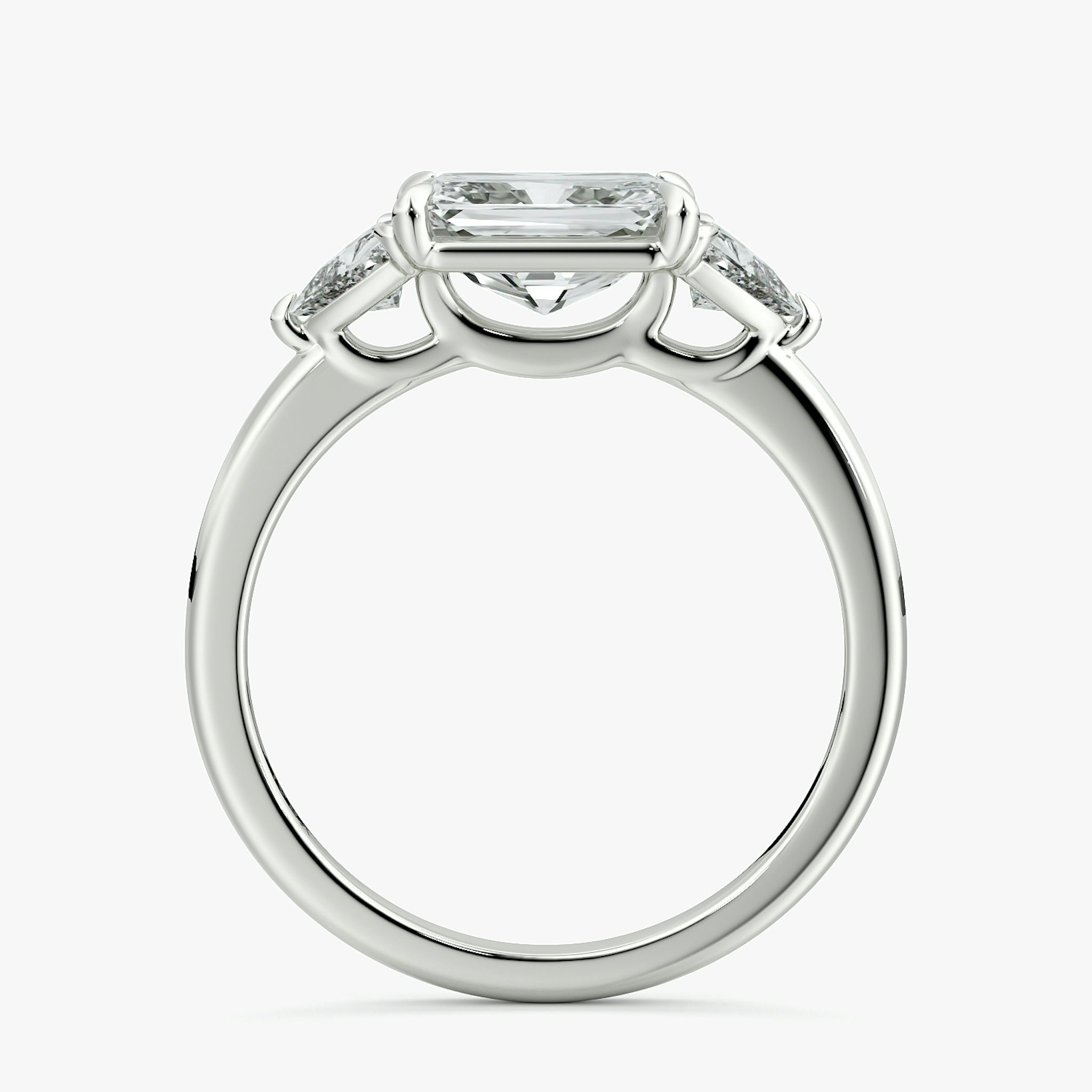 The Three Stone | Radiant | Platinum | bandAccent: Plain | diamondOrientation: horizontal | sideStoneCarat: 0.25ct | sideStoneShape: Trillion | caratWeight: other