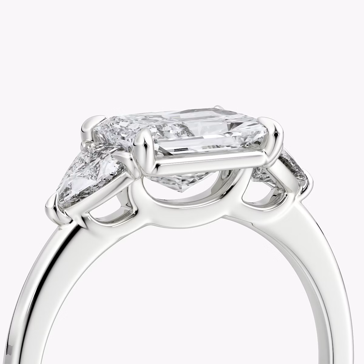 The Three Stone | Radiant | 18k | White Gold | bandAccent: Plain | diamondOrientation: horizontal | sideStoneCarat: 0.25ct | sideStoneShape: Trillion | caratWeight: other