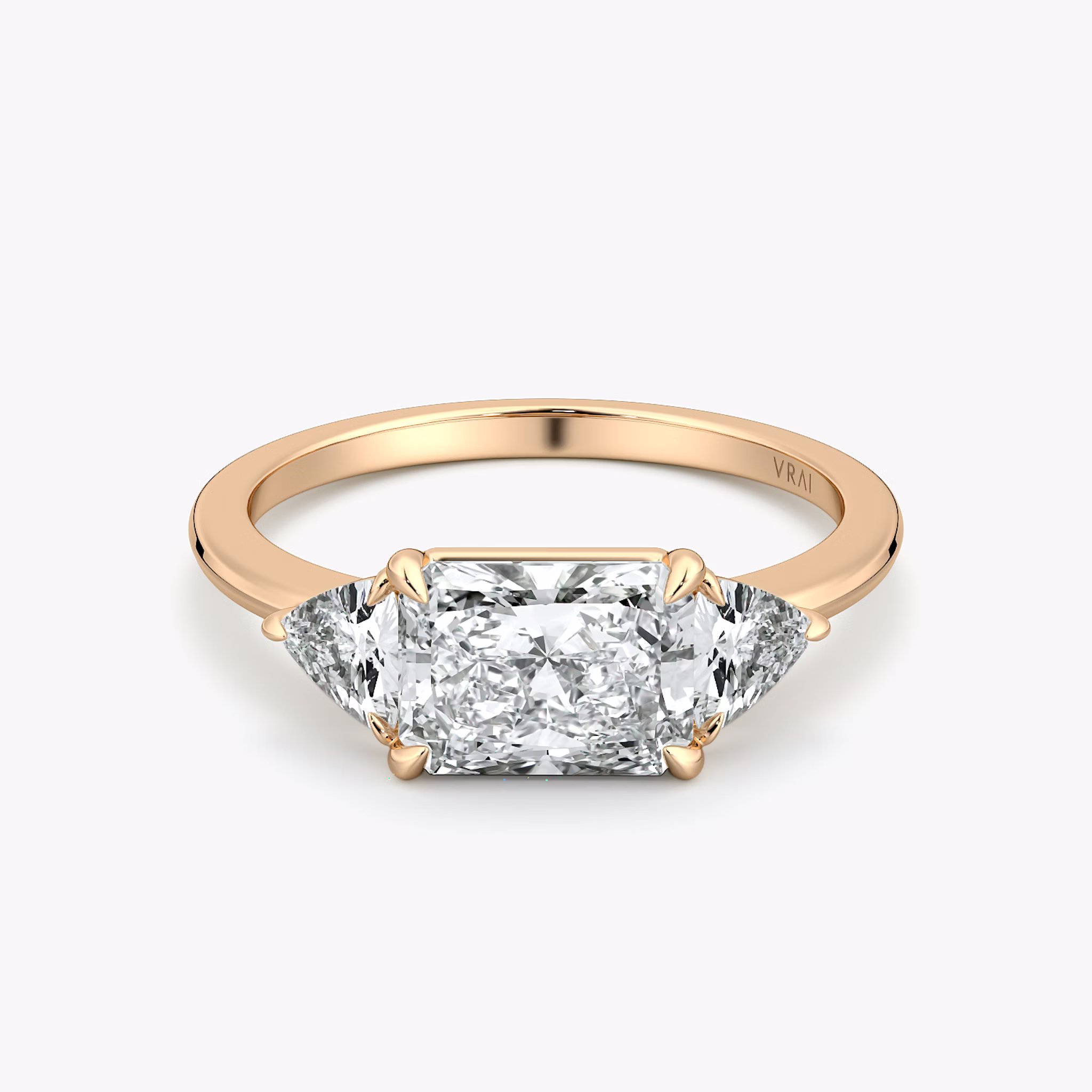 The Three Stone | Radiant | 14k | Rose Gold | bandAccent: Plain | diamondOrientation: horizontal | sideStoneCarat: 0.25ct | sideStoneShape: Trillion | caratWeight: other