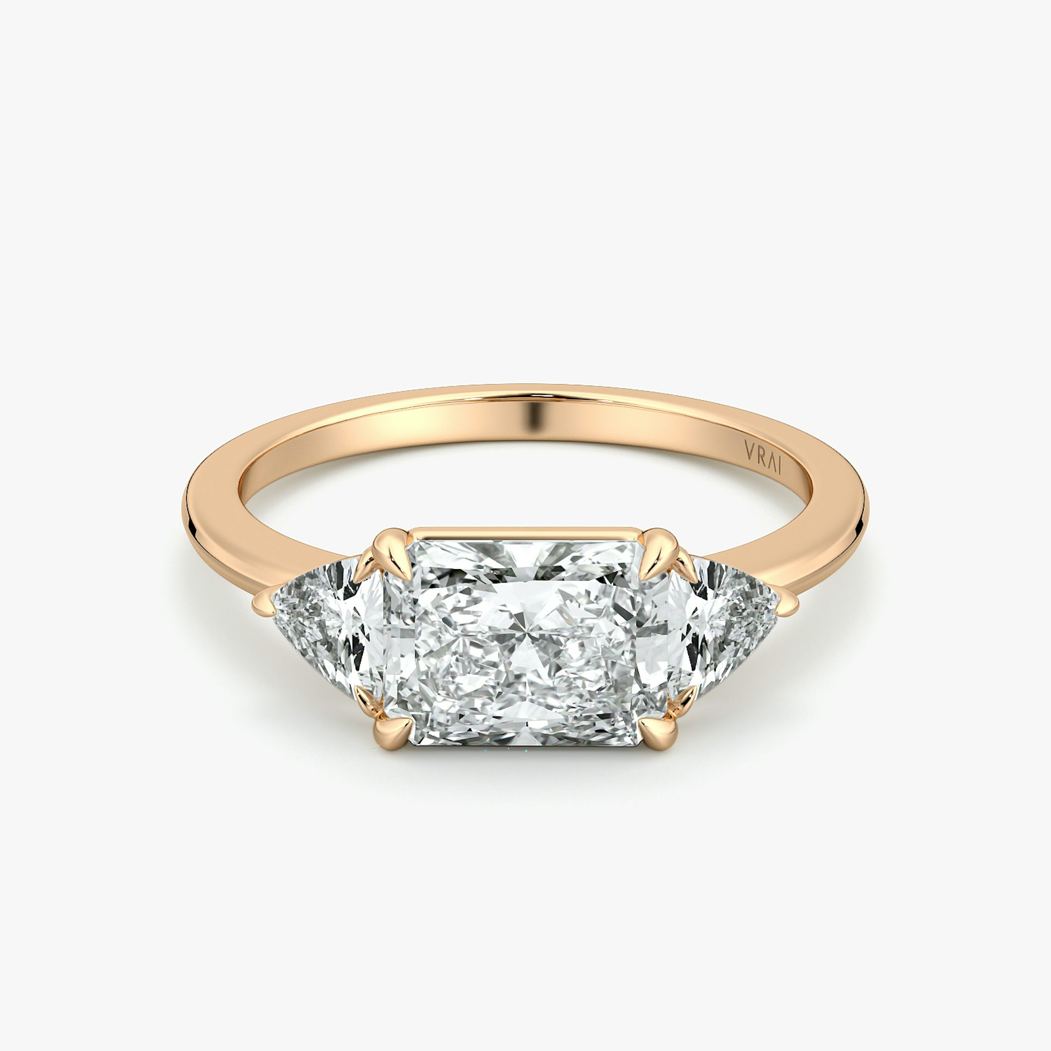 The Three Stone | Radiant | 14k | Rose Gold | bandAccent: Plain | diamondOrientation: horizontal | sideStoneCarat: 0.25ct | sideStoneShape: Trillion | caratWeight: other