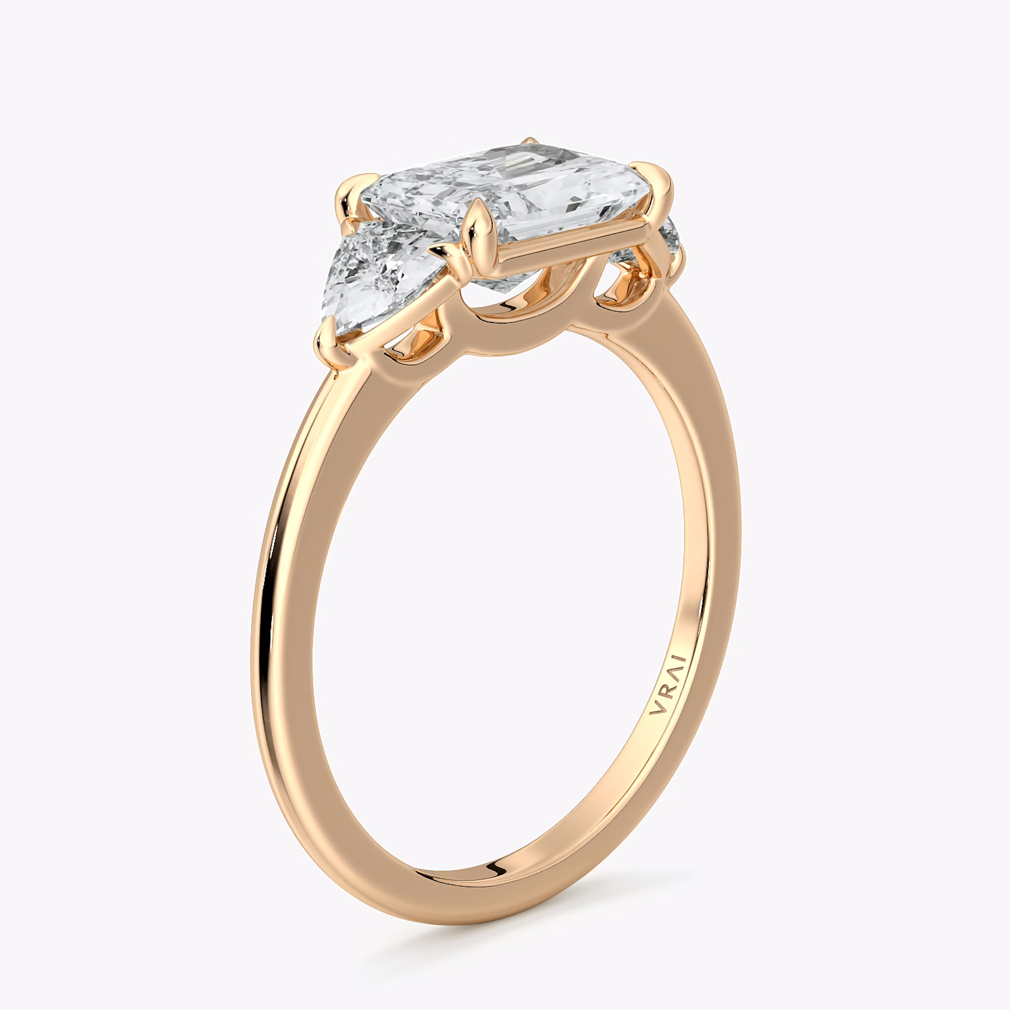 The Three Stone | Radiant | 14k | Rose Gold | bandAccent: Plain | diamondOrientation: horizontal | sideStoneCarat: 0.25ct | sideStoneShape: Trillion | caratWeight: other