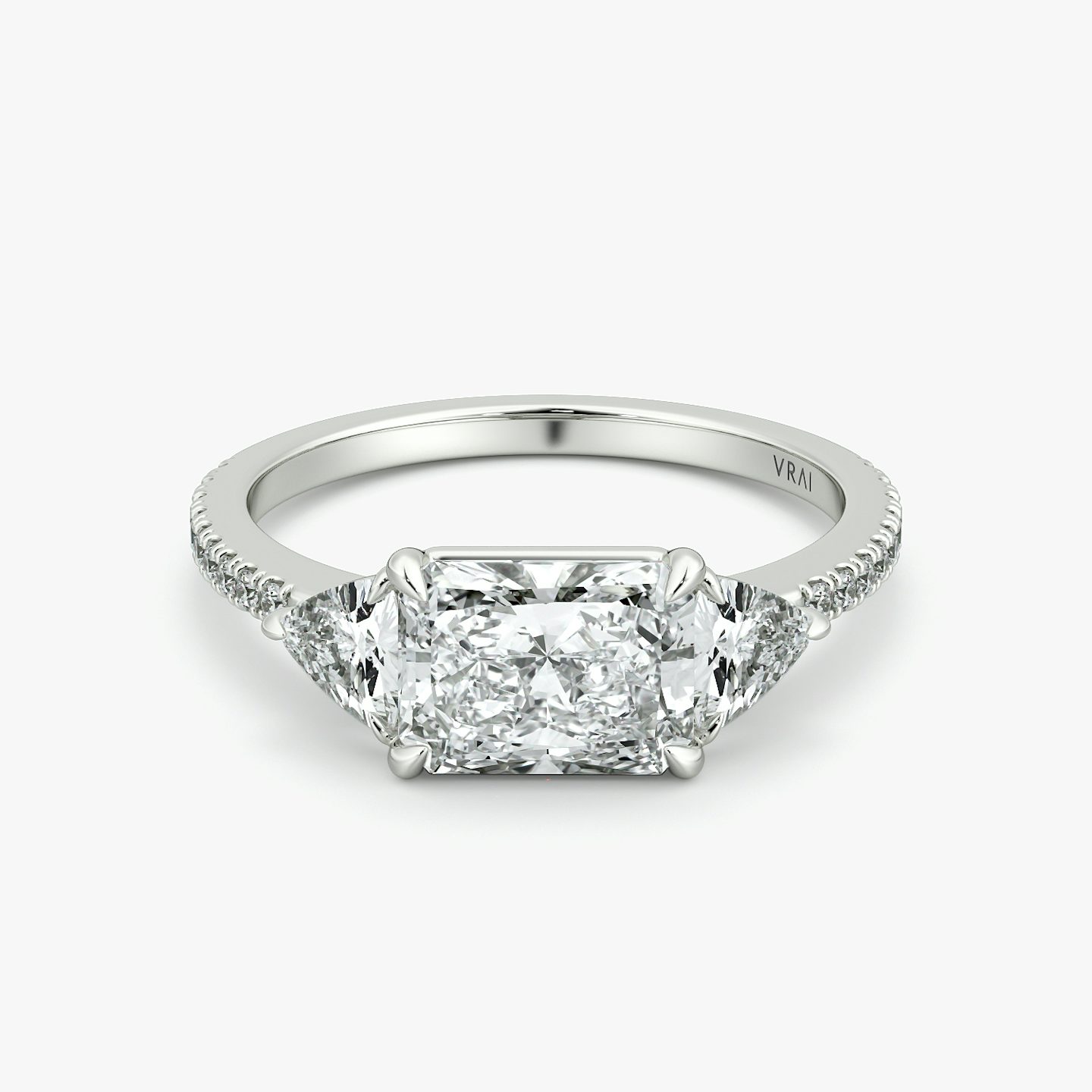 The Three Stone | Radiant | Platinum | bandAccent: Pavé | diamondOrientation: horizontal | sideStoneCarat: 0.25ct | sideStoneShape: Trillion | caratWeight: other