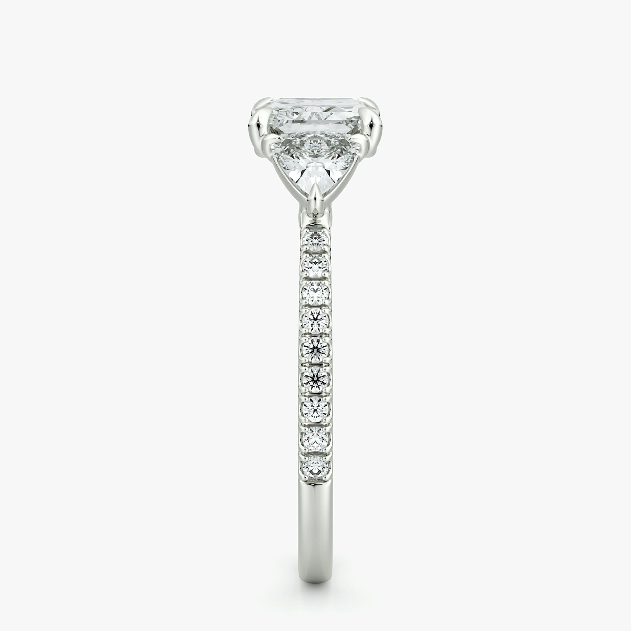 The Three Stone | Radiant | Platinum | bandAccent: Pavé | diamondOrientation: horizontal | sideStoneCarat: 0.25ct | sideStoneShape: Trillion | caratWeight: other