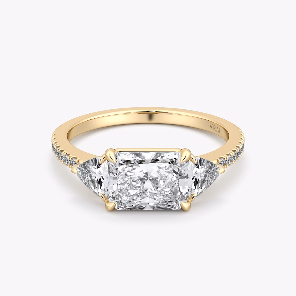 The Three Stone | Radiant | 18k | Yellow Gold | bandAccent: Pavé | diamondOrientation: horizontal | sideStoneCarat: 0.25ct | sideStoneShape: Trillion | caratWeight: other