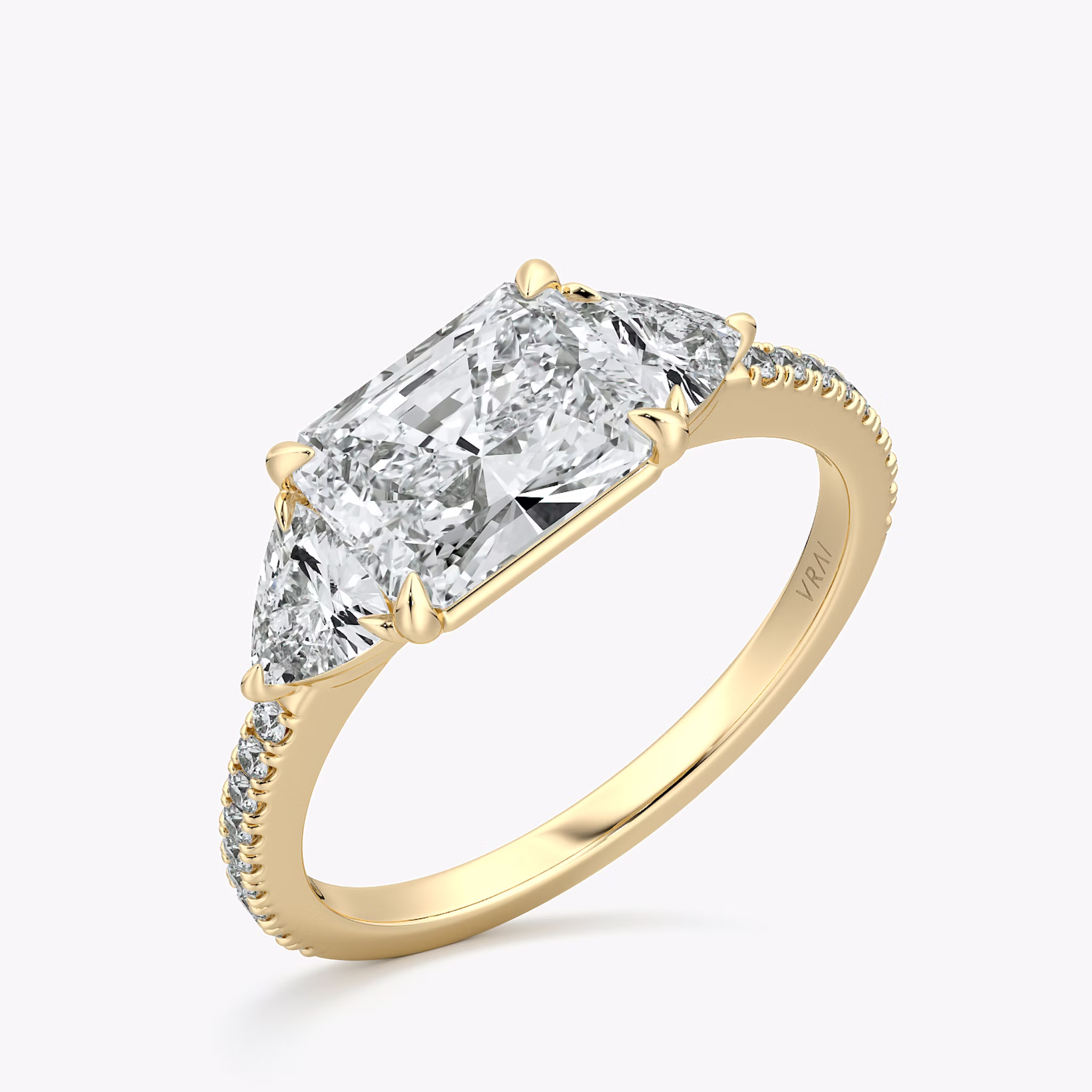 The Three Stone | Radiant | 18k | Yellow Gold | bandAccent: Pavé | diamondOrientation: horizontal | sideStoneCarat: 0.25ct | sideStoneShape: Trillion | caratWeight: other