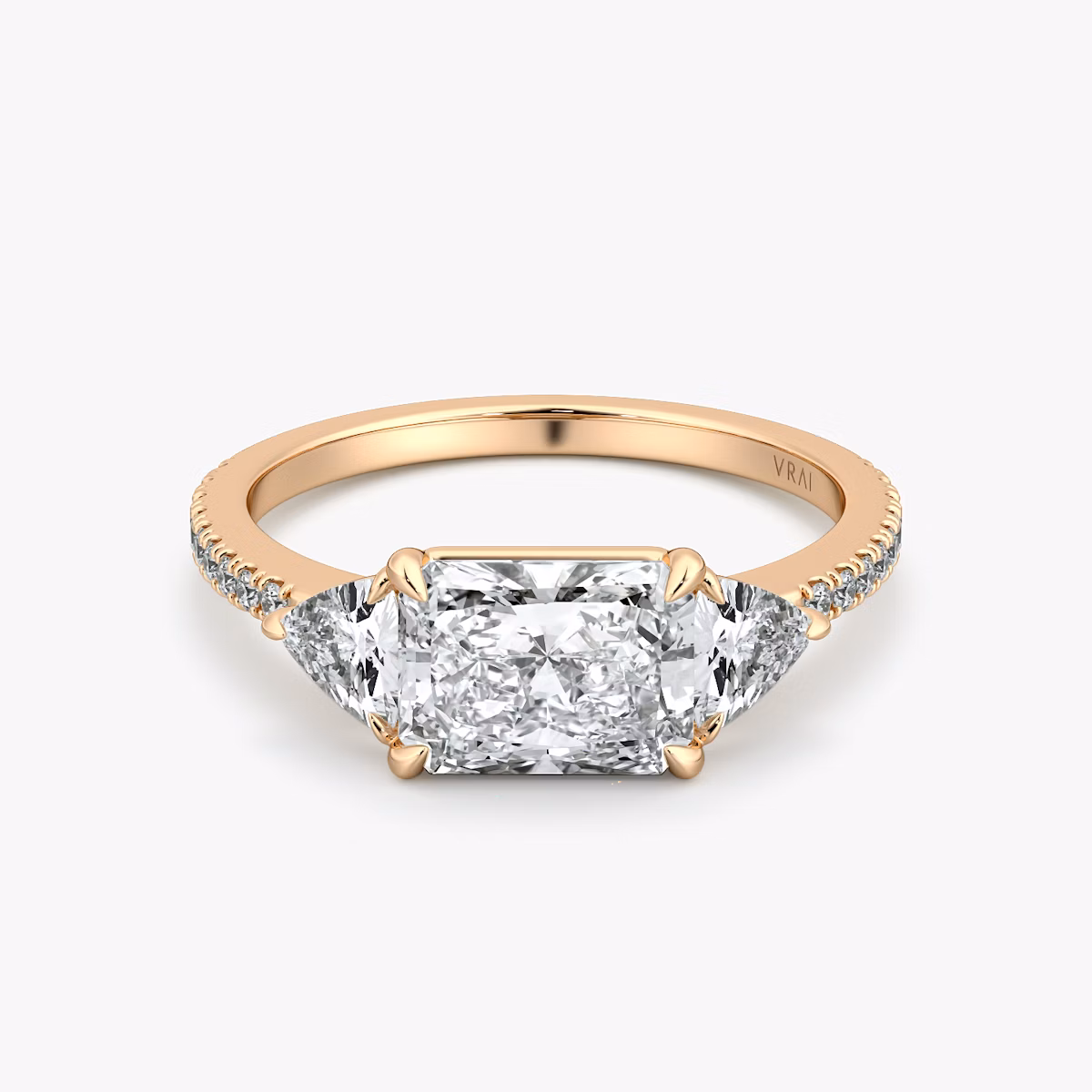 The Three Stone | Radiant | 14k | Rose Gold | bandAccent: Pavé | diamondOrientation: horizontal | sideStoneCarat: 0.25ct | sideStoneShape: Trillion | caratWeight: other