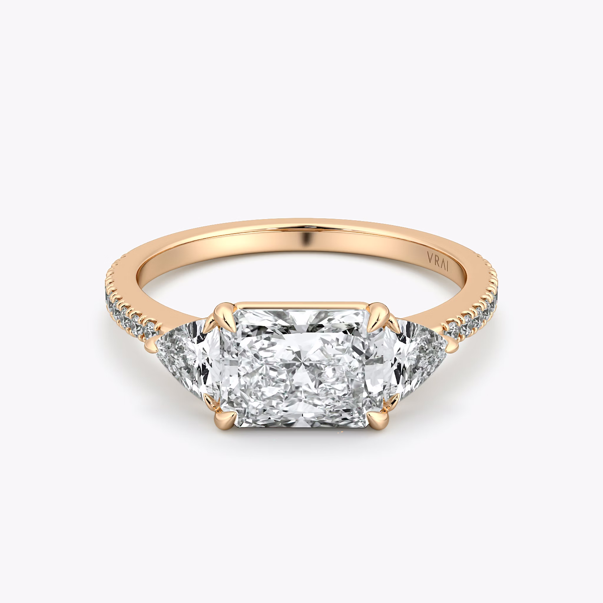 The Three Stone | Radiant | 14k | Rose Gold | bandAccent: Pavé | diamondOrientation: horizontal | sideStoneCarat: 0.25ct | sideStoneShape: Trillion | caratWeight: other