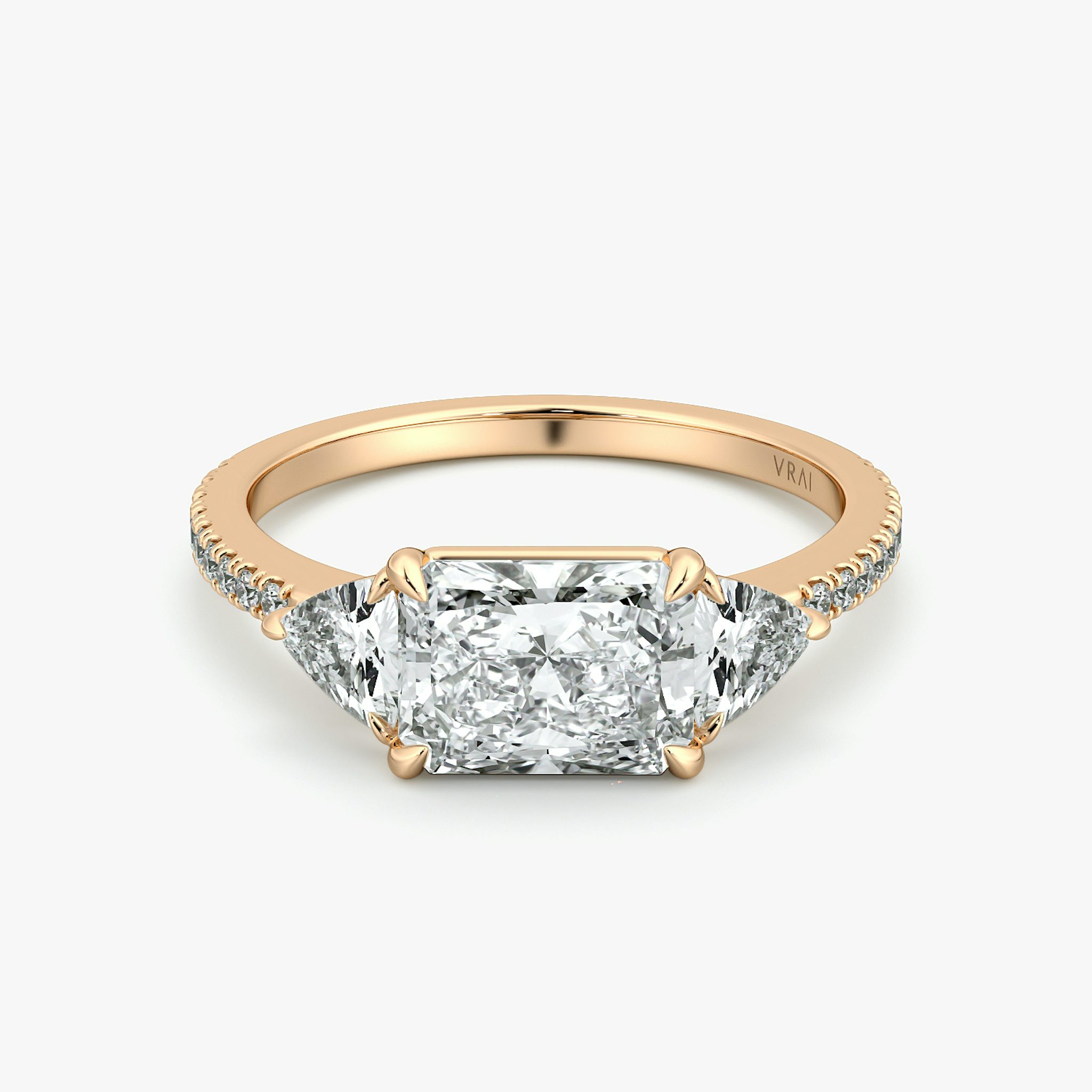 The Three Stone | Radiant | 14k | Rose Gold | bandAccent: Pavé | diamondOrientation: horizontal | sideStoneCarat: 0.25ct | sideStoneShape: Trillion | caratWeight: other