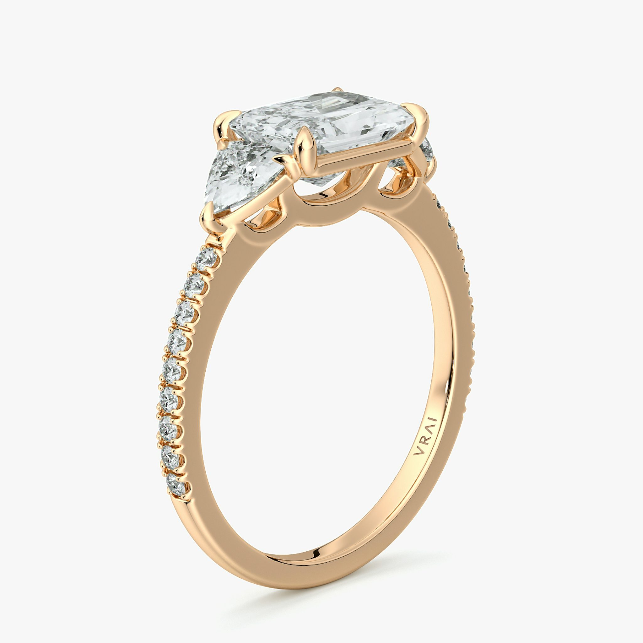 The Three Stone | Radiant | 14k | Rose Gold | bandAccent: Pavé | diamondOrientation: horizontal | sideStoneCarat: 0.25ct | sideStoneShape: Trillion | caratWeight: other