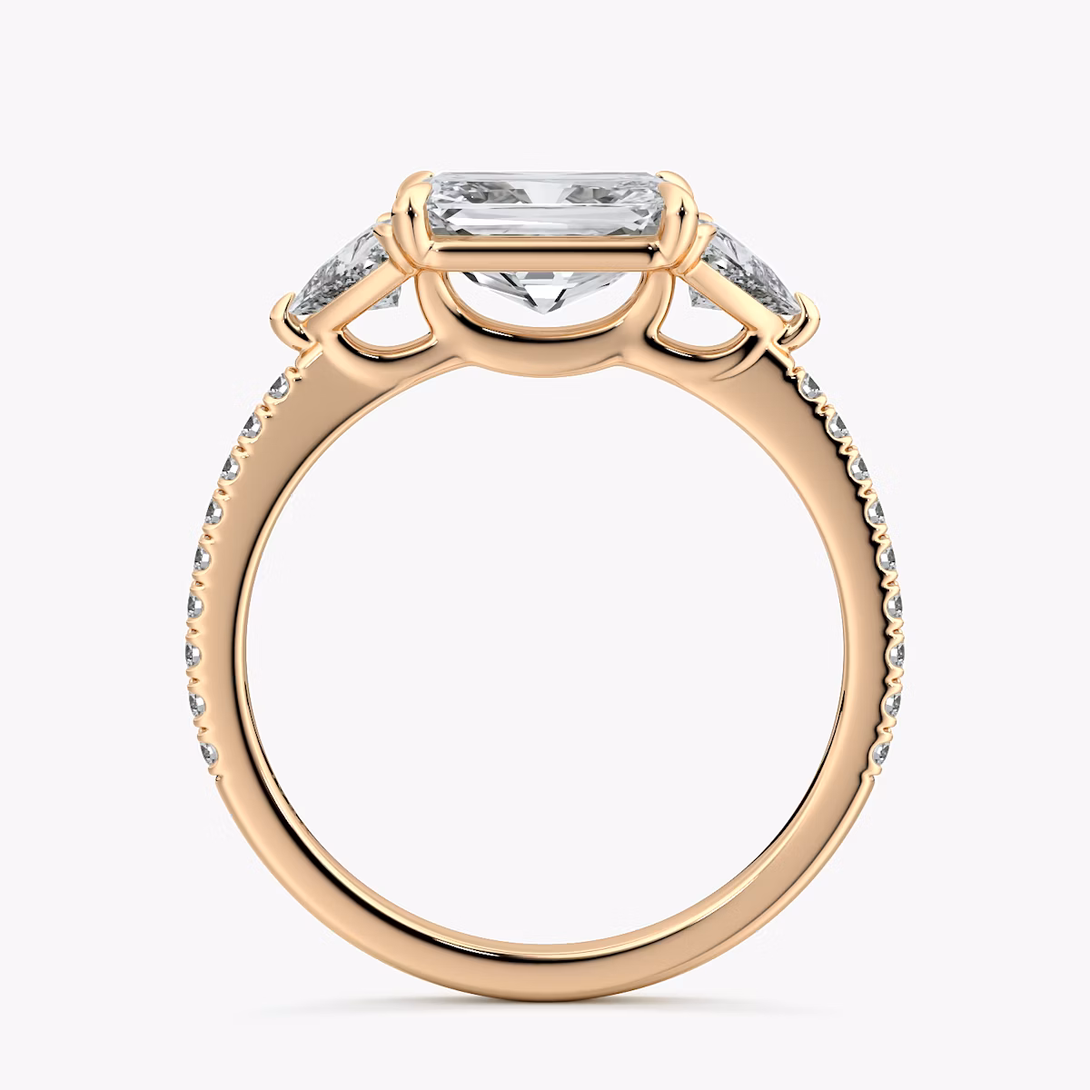 The Three Stone | Radiant | 14k | Rose Gold | bandAccent: Pavé | diamondOrientation: horizontal | sideStoneCarat: 0.25ct | sideStoneShape: Trillion | caratWeight: other