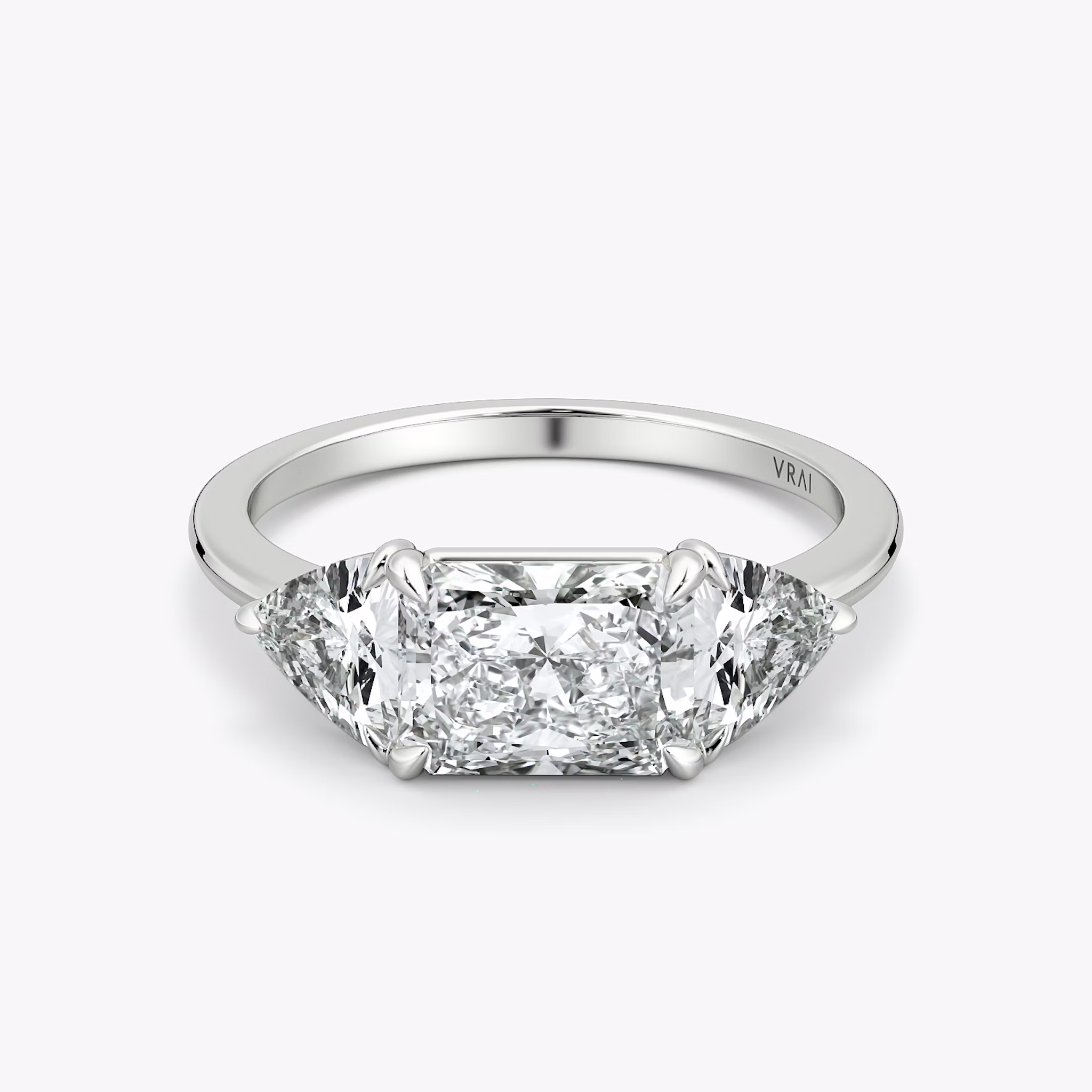 The Three Stone | Radiant | Platinum | bandAccent: Plain | diamondOrientation: horizontal | sideStoneCarat: 0.50ct | sideStoneShape: Trillion | caratWeight: other