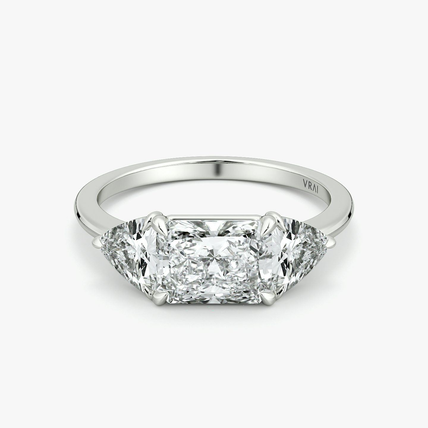 The Three Stone | Radiant | 18k | White Gold | bandAccent: Plain | diamondOrientation: horizontal | sideStoneCarat: 0.50ct | sideStoneShape: Trillion | caratWeight: other