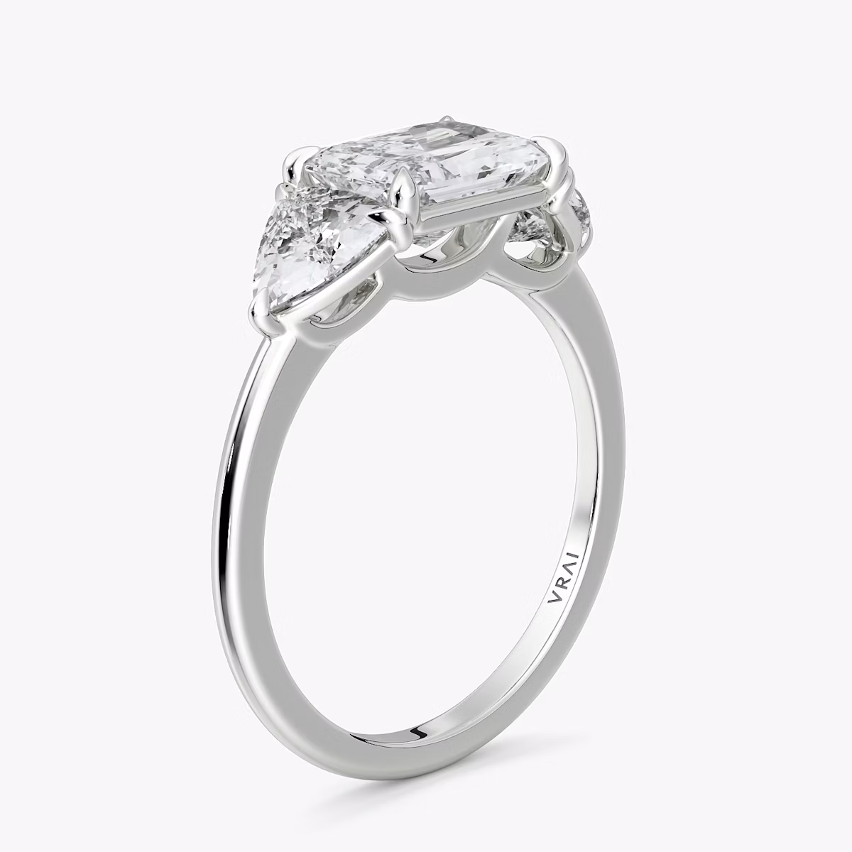 The Three Stone | Radiant | Platinum | bandAccent: Plain | diamondOrientation: horizontal | sideStoneCarat: 0.50ct | sideStoneShape: Trillion | caratWeight: other
