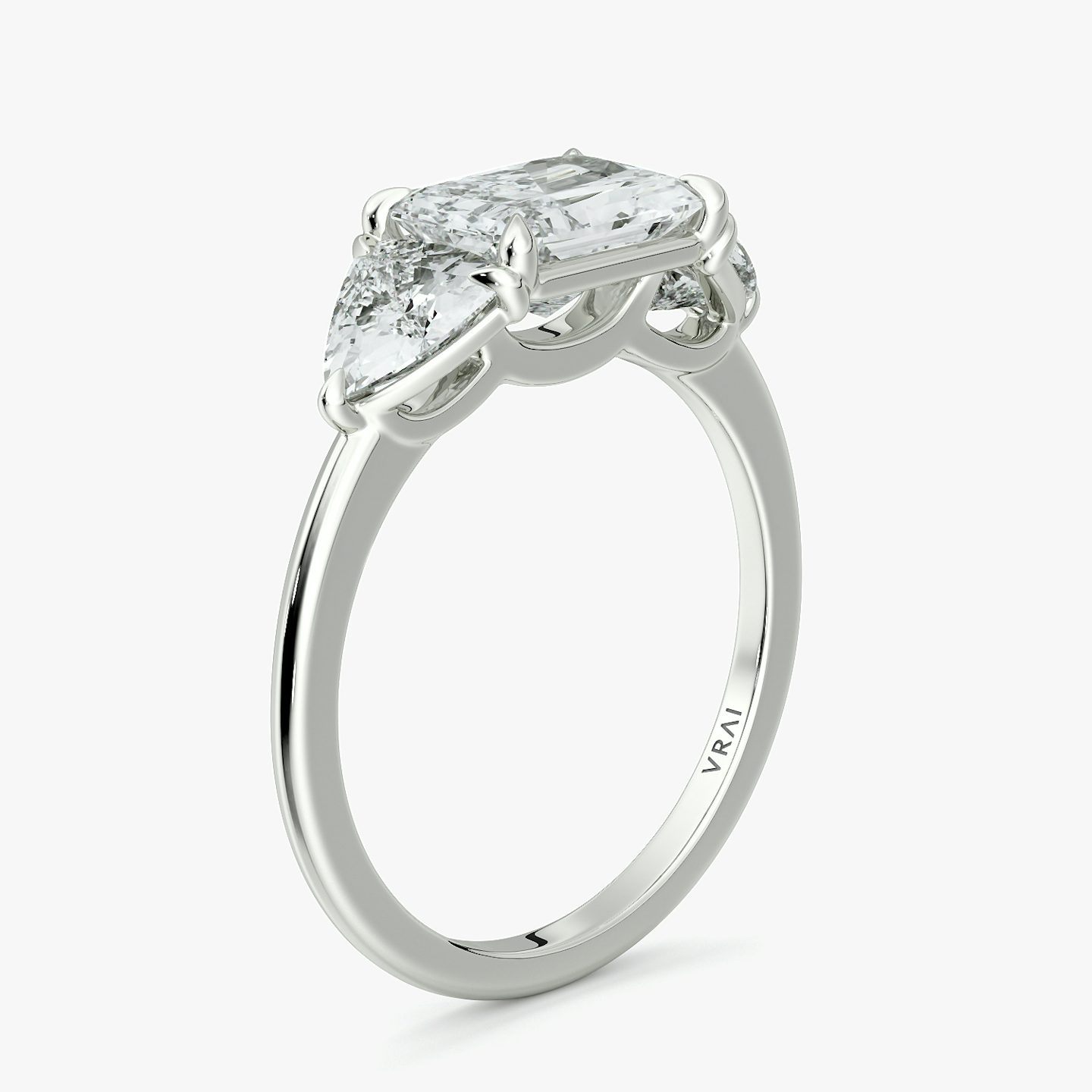 The Three Stone | Radiant | 18k | White Gold | bandAccent: Plain | diamondOrientation: horizontal | sideStoneCarat: 0.50ct | sideStoneShape: Trillion | caratWeight: other